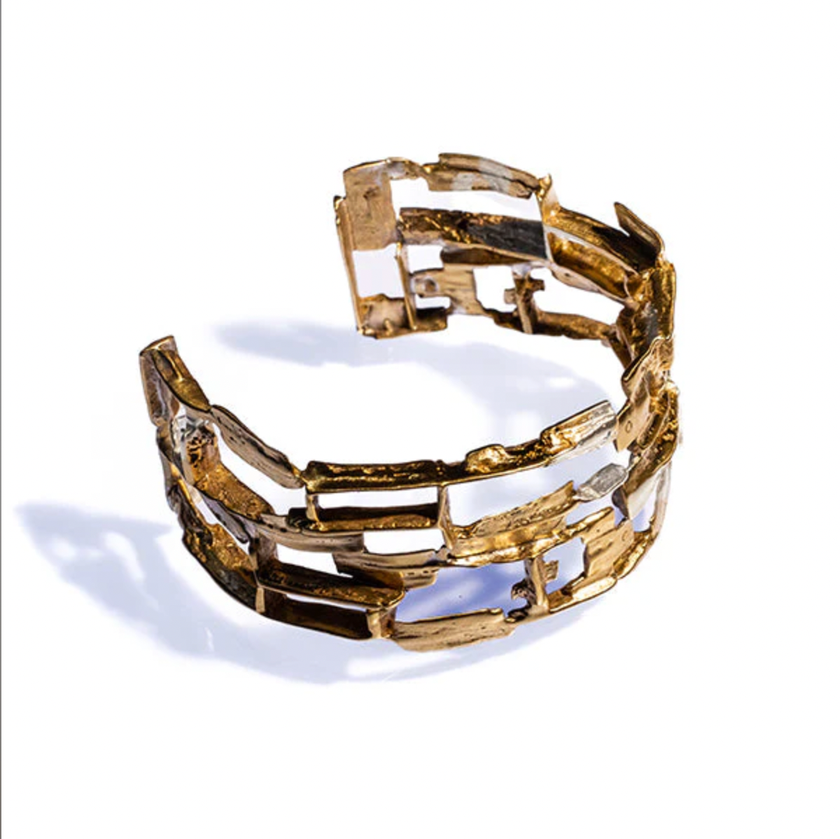 Gold bracelet on a white background