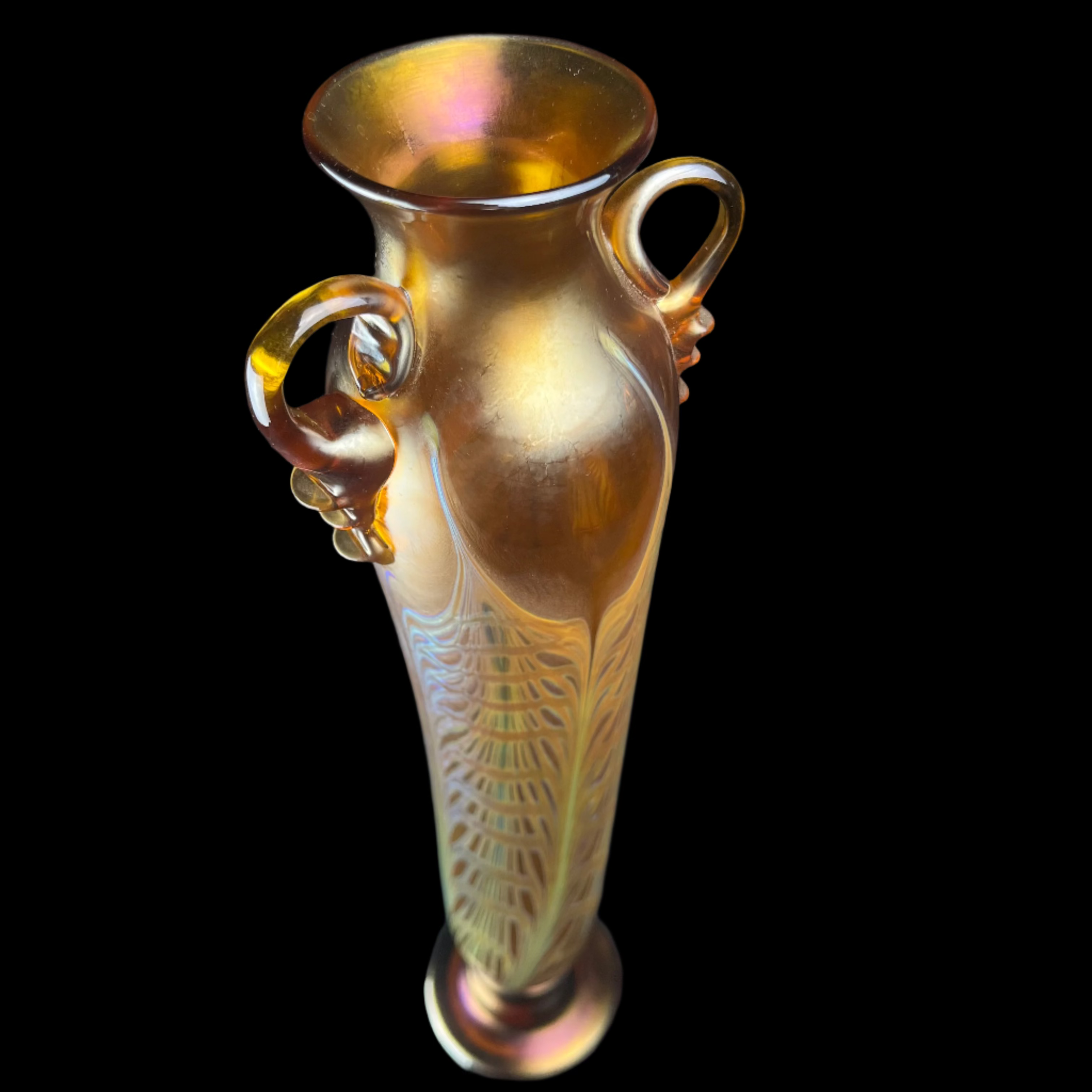 Decorative vase with handles on a black background