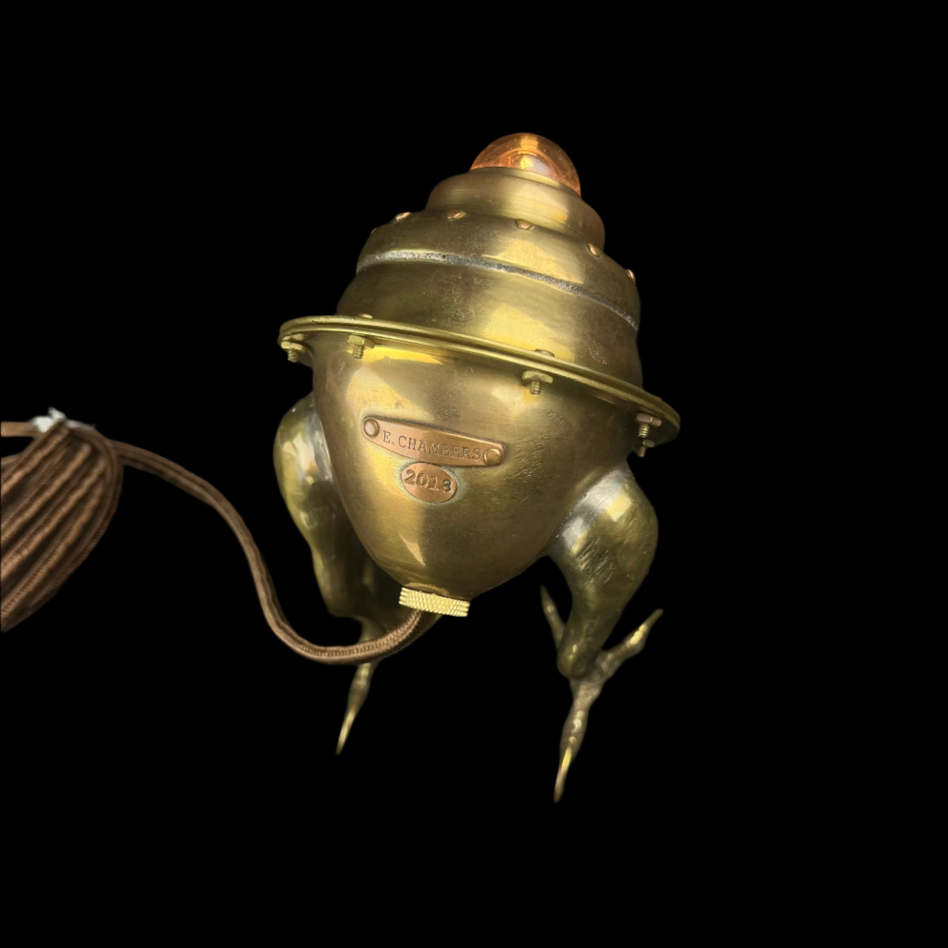 Vintage brass light fixture on a dark background