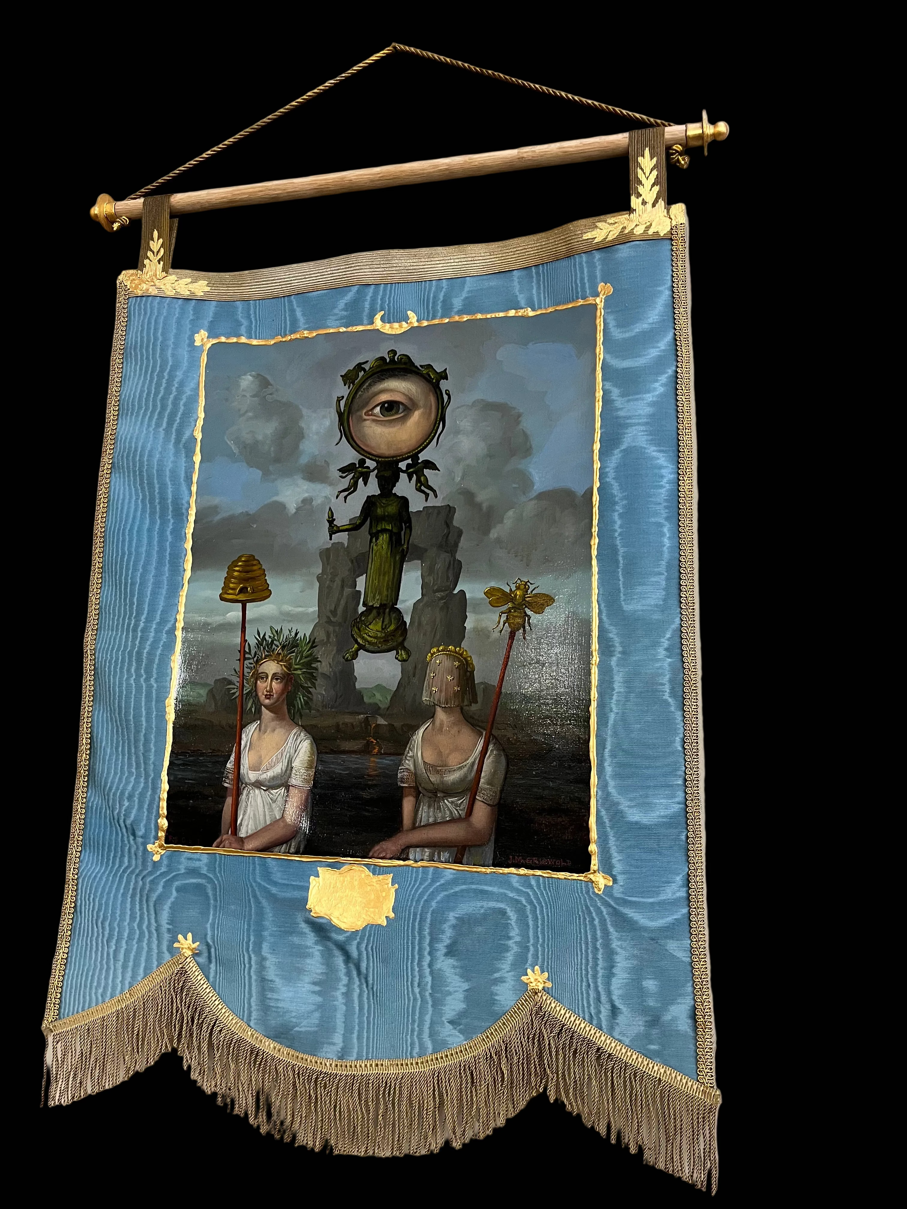 Decorative banner with artistic design of two figures and a mechanical eye, framed in gold on a blue background.