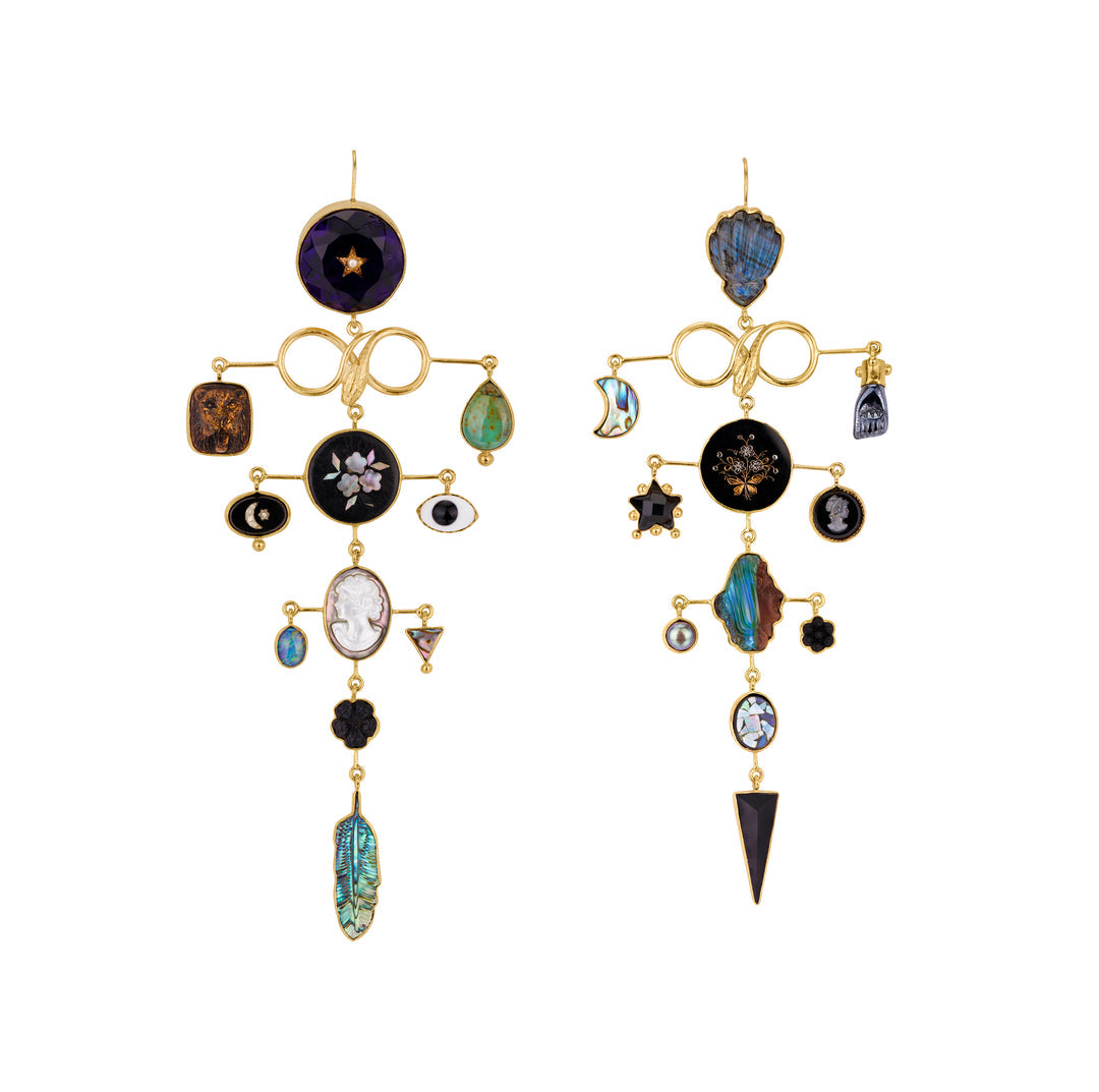 Serpents with balancing dark toned charms hanging in downward facing triangle