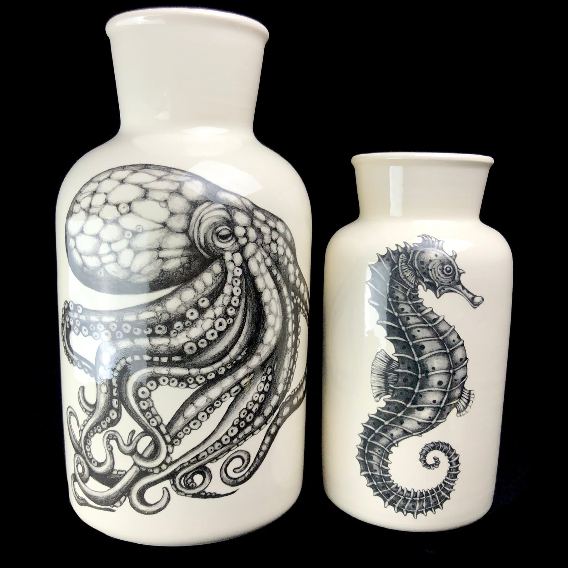 Seahorse vase sitting next to Octopus Vase of larger size