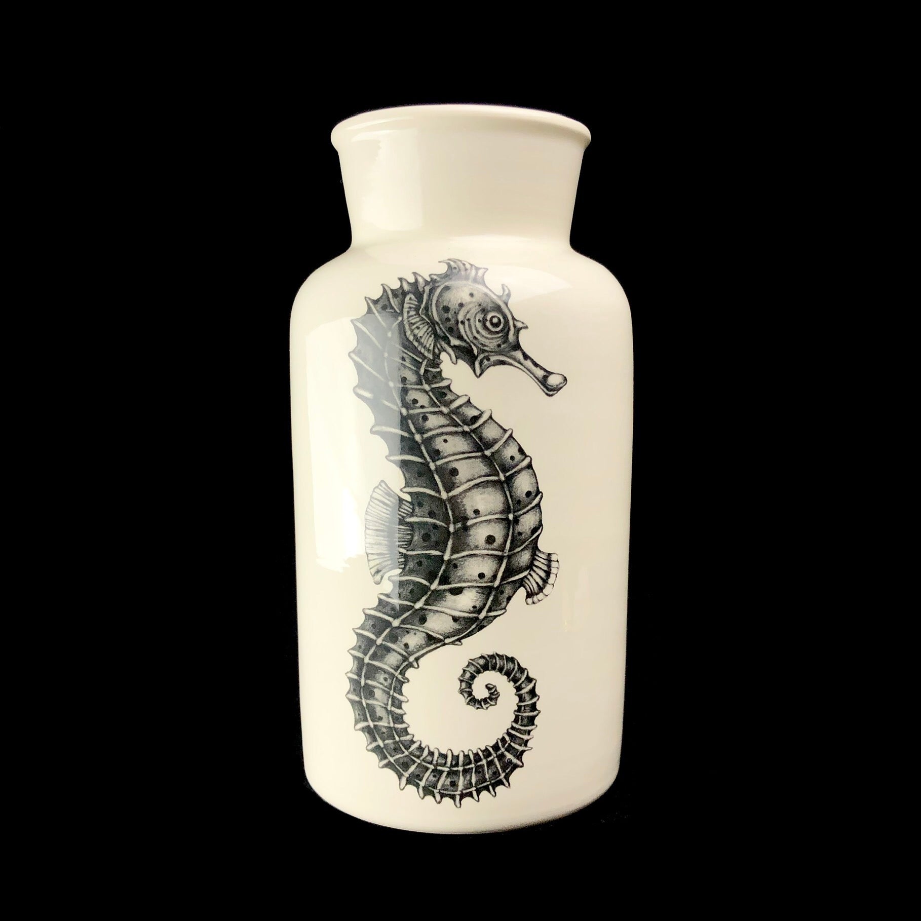 White vase with grey drawing of seahorse