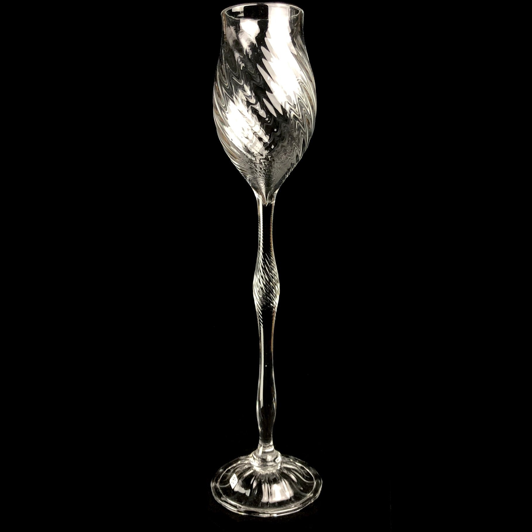Clear glass goblet with liquid like design 