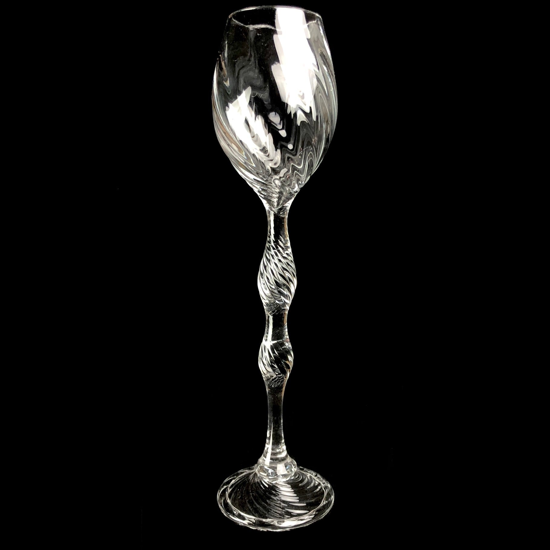 Clear glass goblet with intricate ribbed surface design