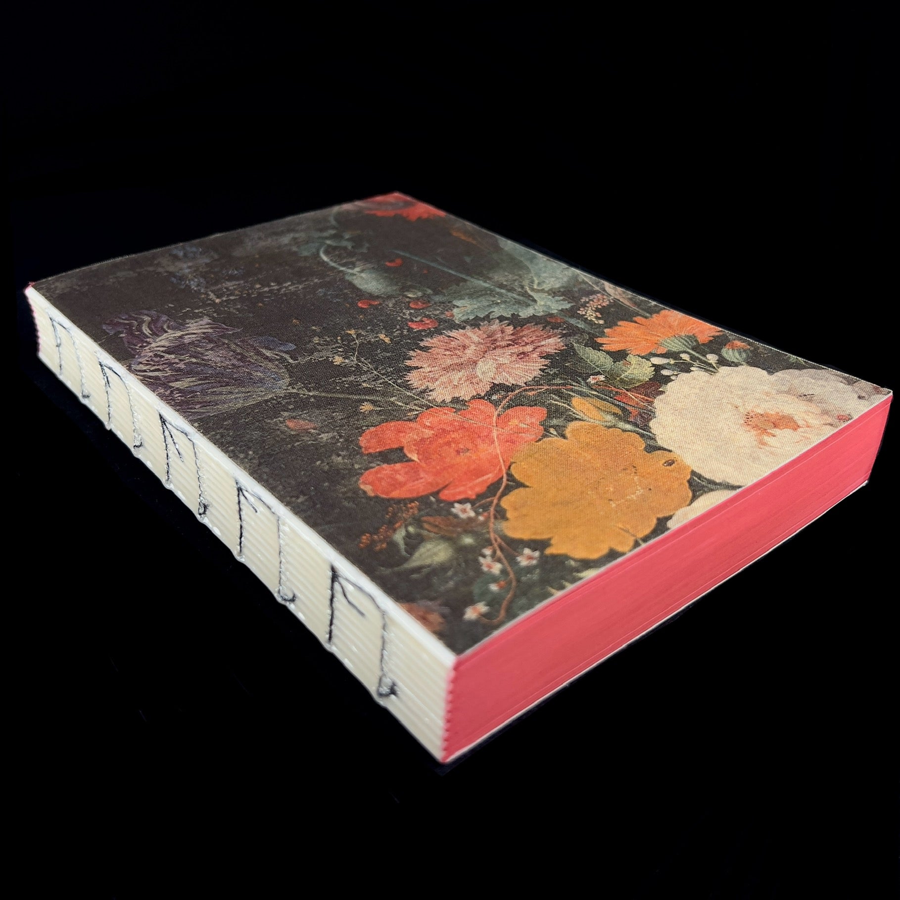 Side view of Floral Bouquet Journal with binding and red page boundaries