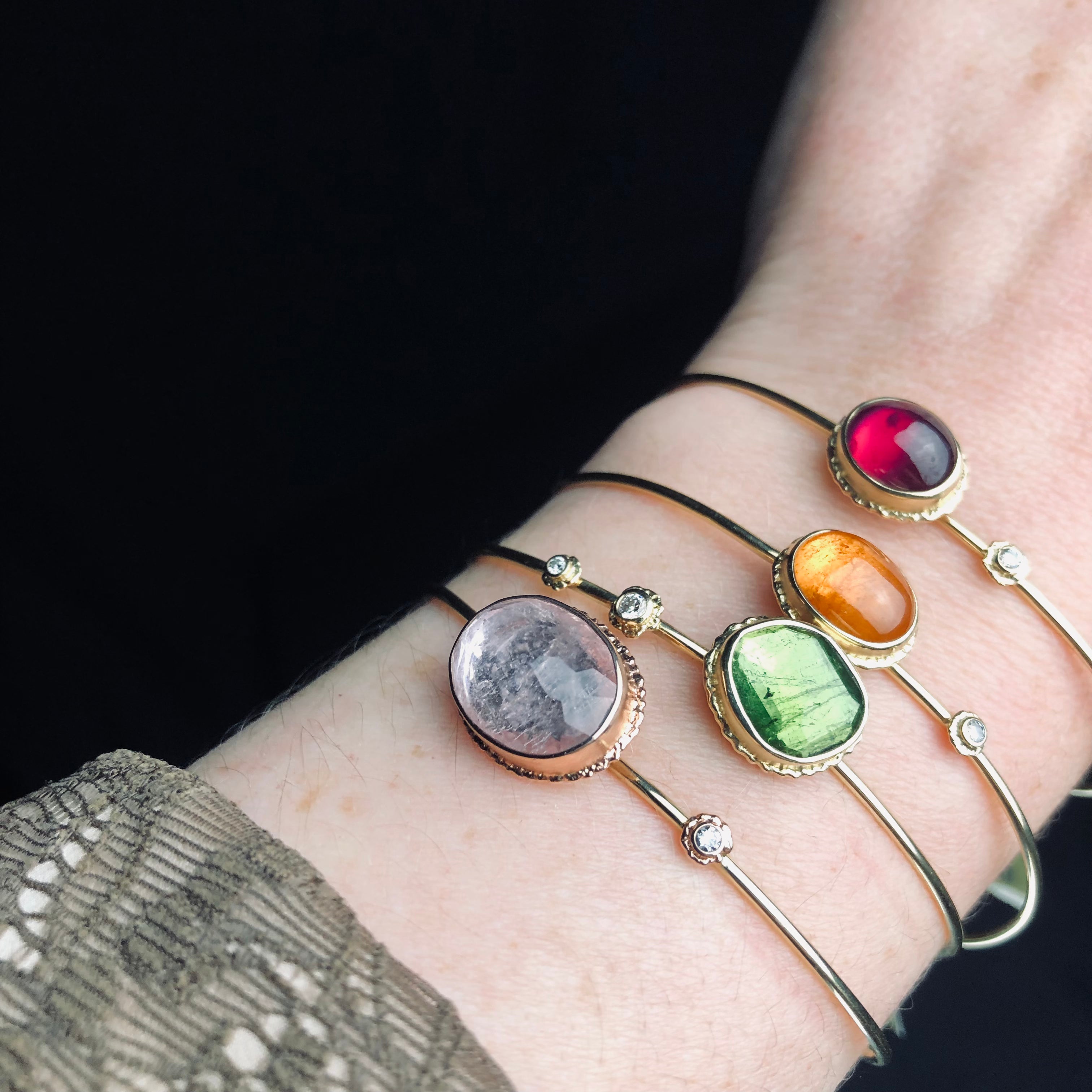 A stack of bracelets with Spessartite shown second from the top