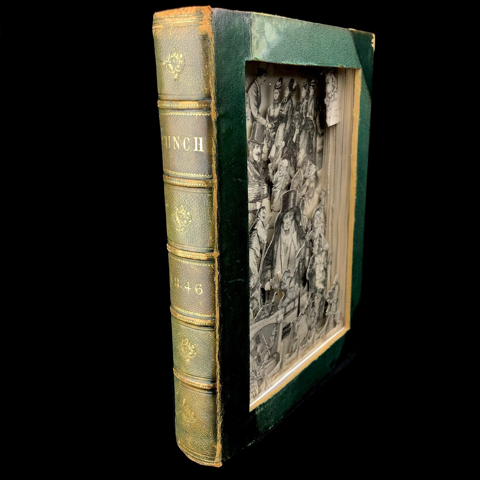 Spine with gold guilt and front view of Punch Magazine Antiquarian Cut Book