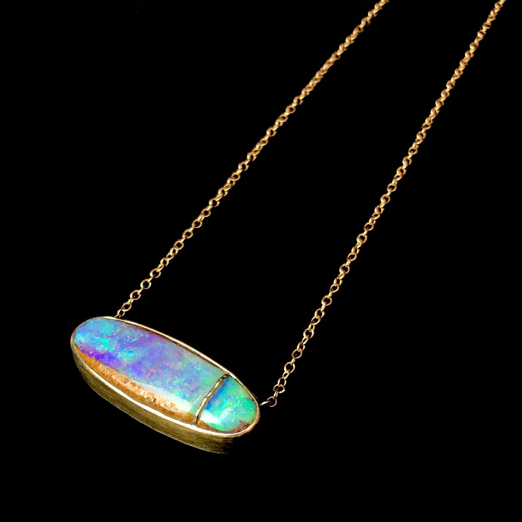 Close up view of Opalized Wood Necklace from the side with depth of stone