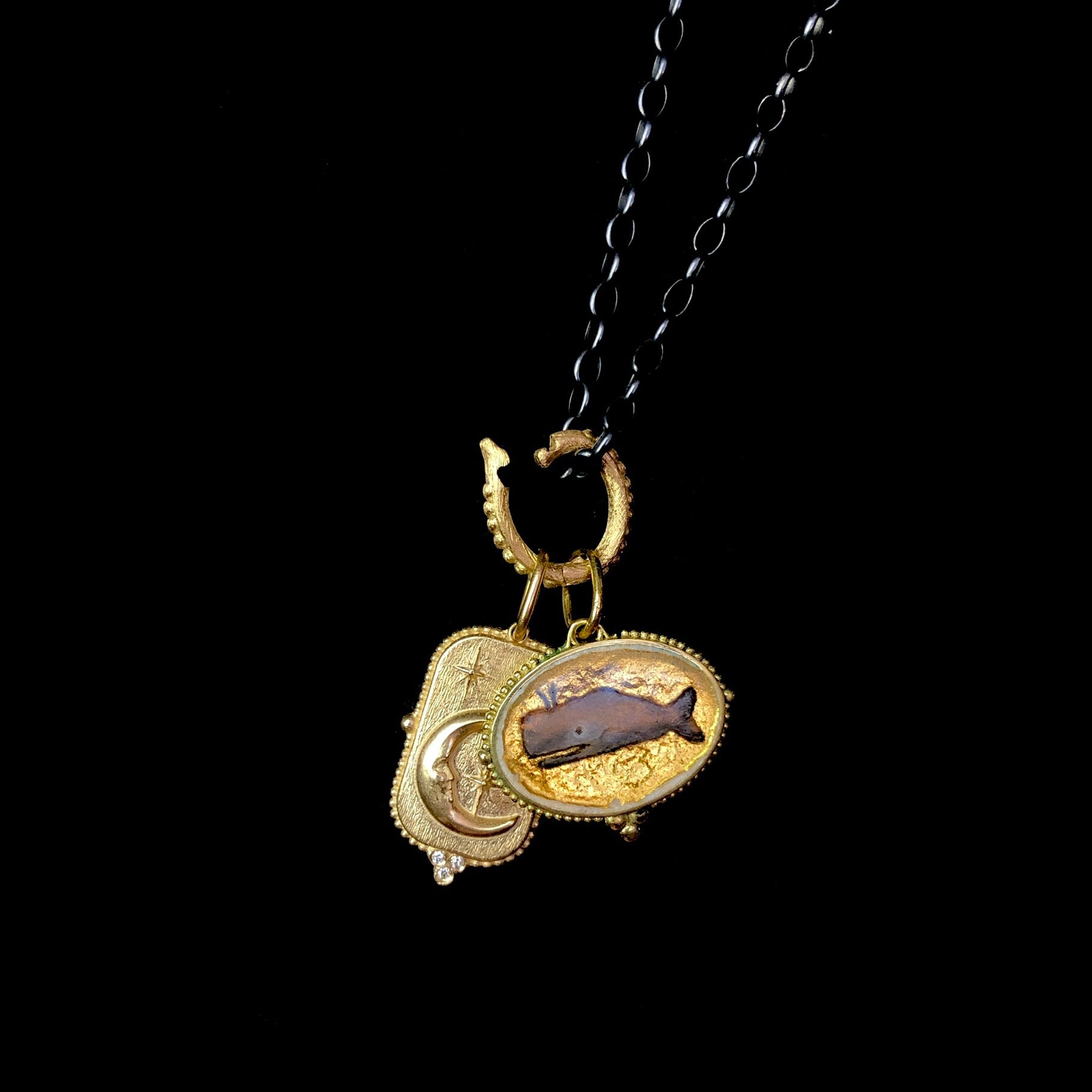 Gold Oval Charm Holder shown on chain with charms ready to be closed