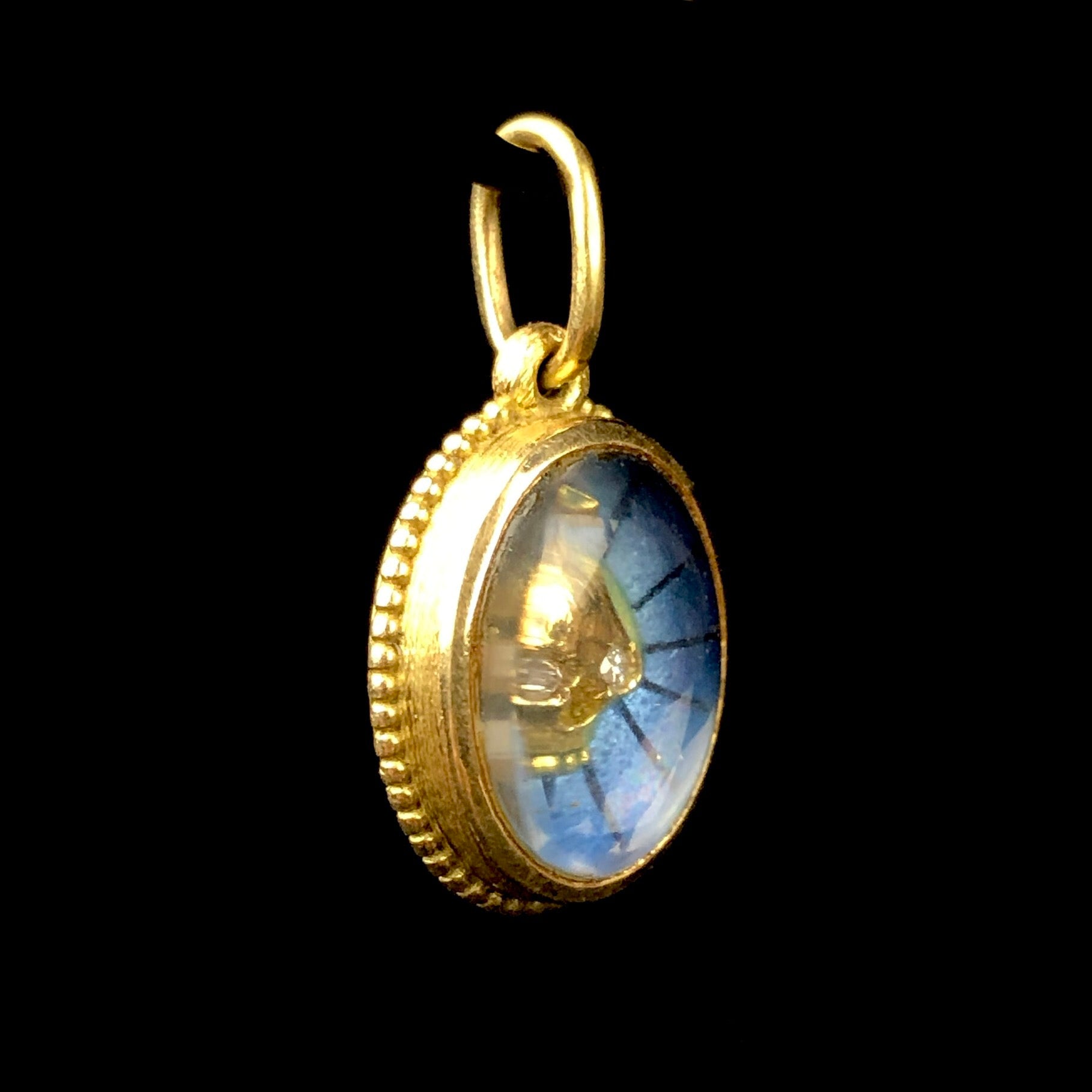 Side view of Blue Enamel Skull Charm