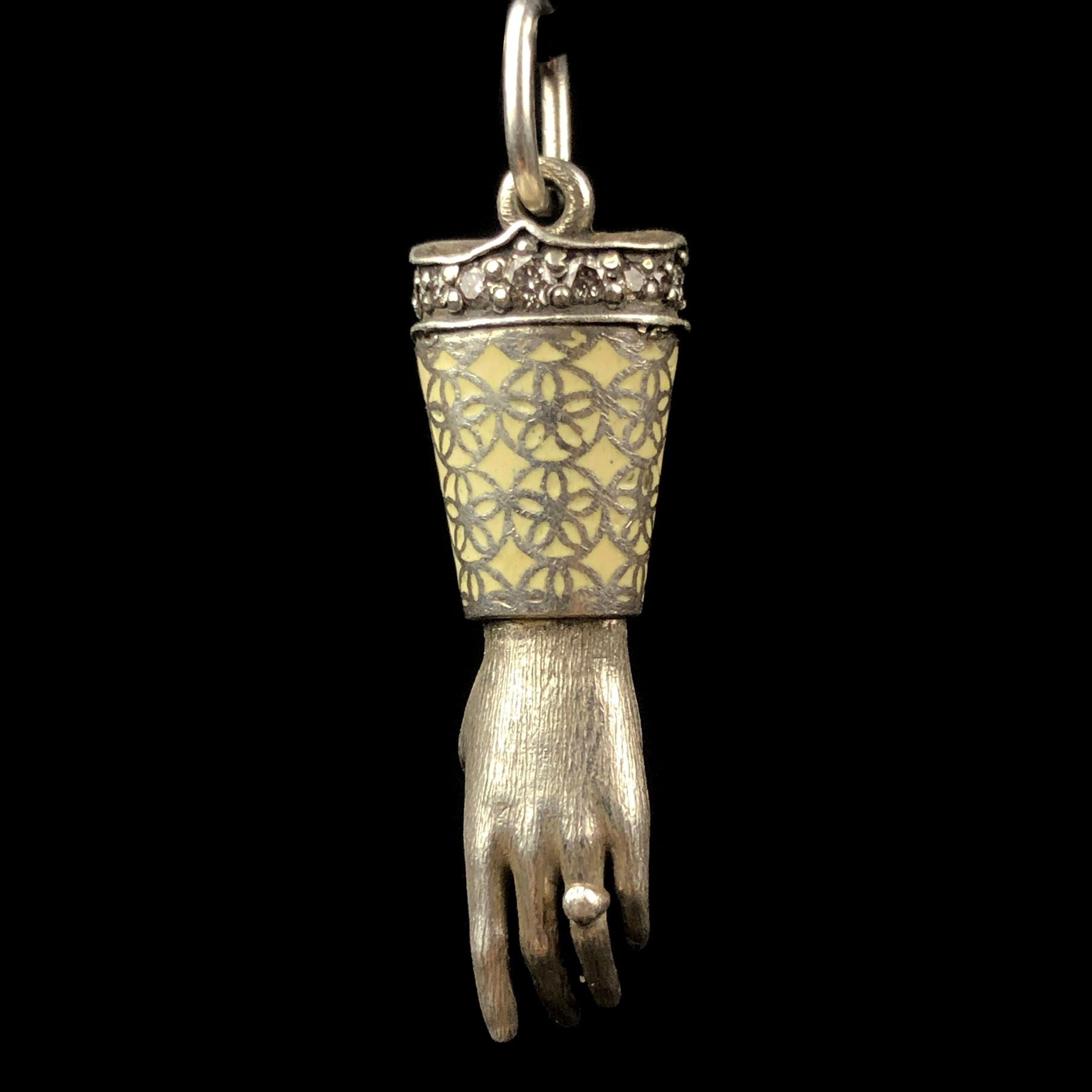 View of the top of the White Enamel Hand Charm