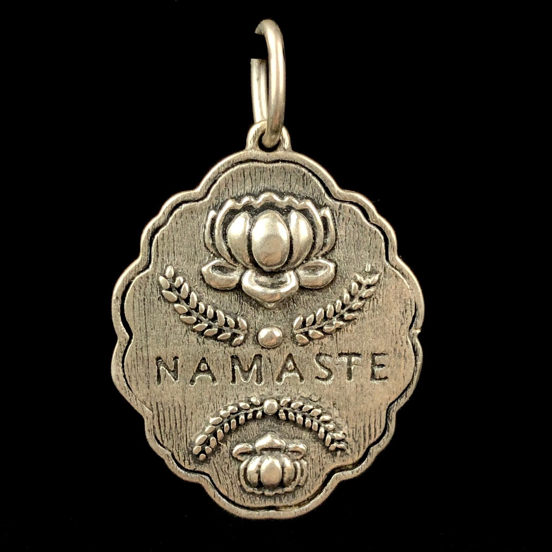Back view of Nameste Charm