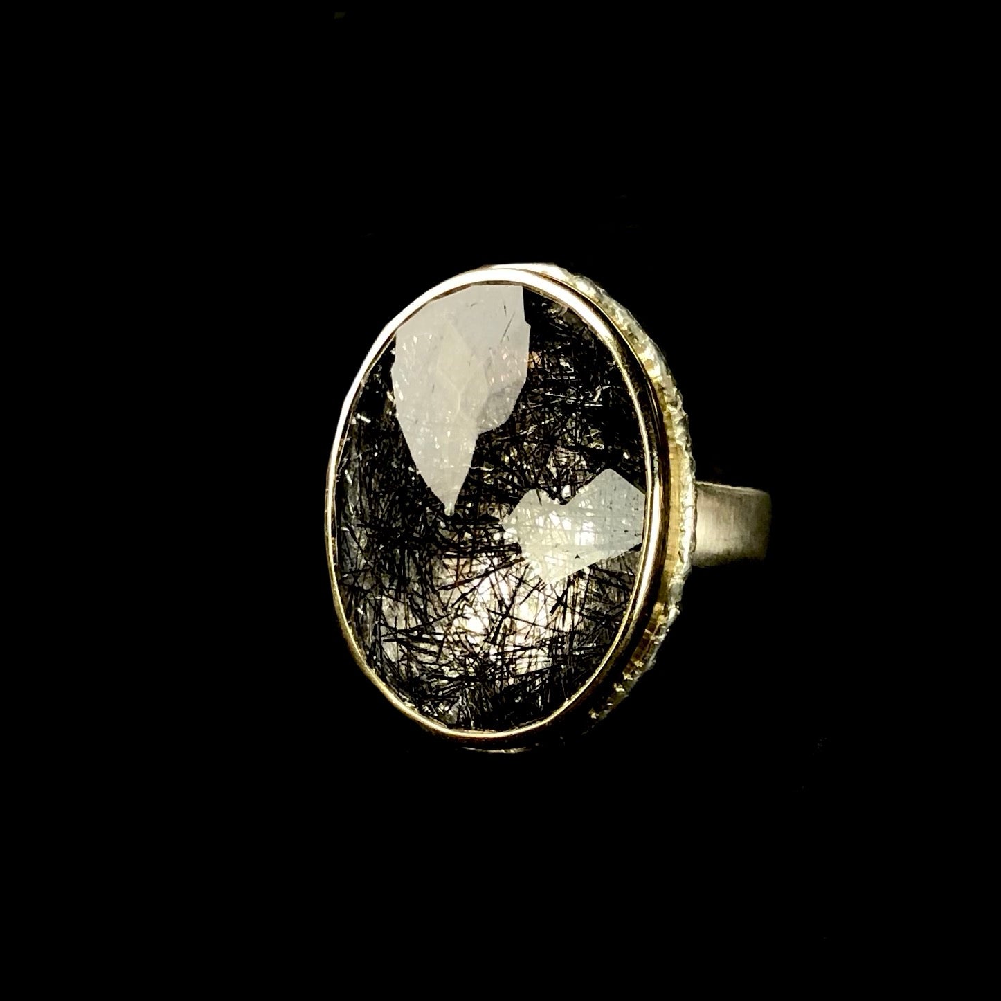 Front view of tourmalinated quartz ring