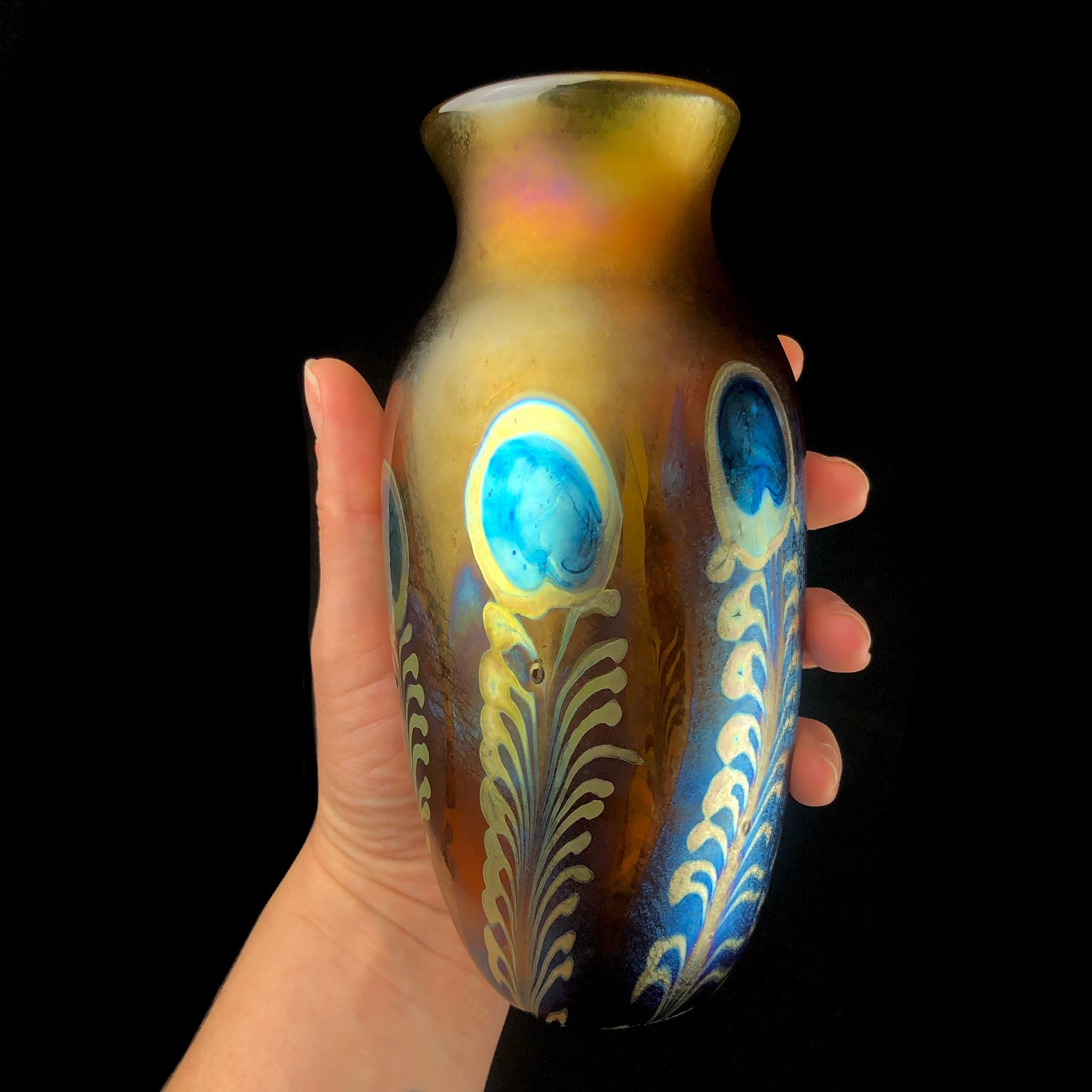 Amber Peacock Vase shown in hand