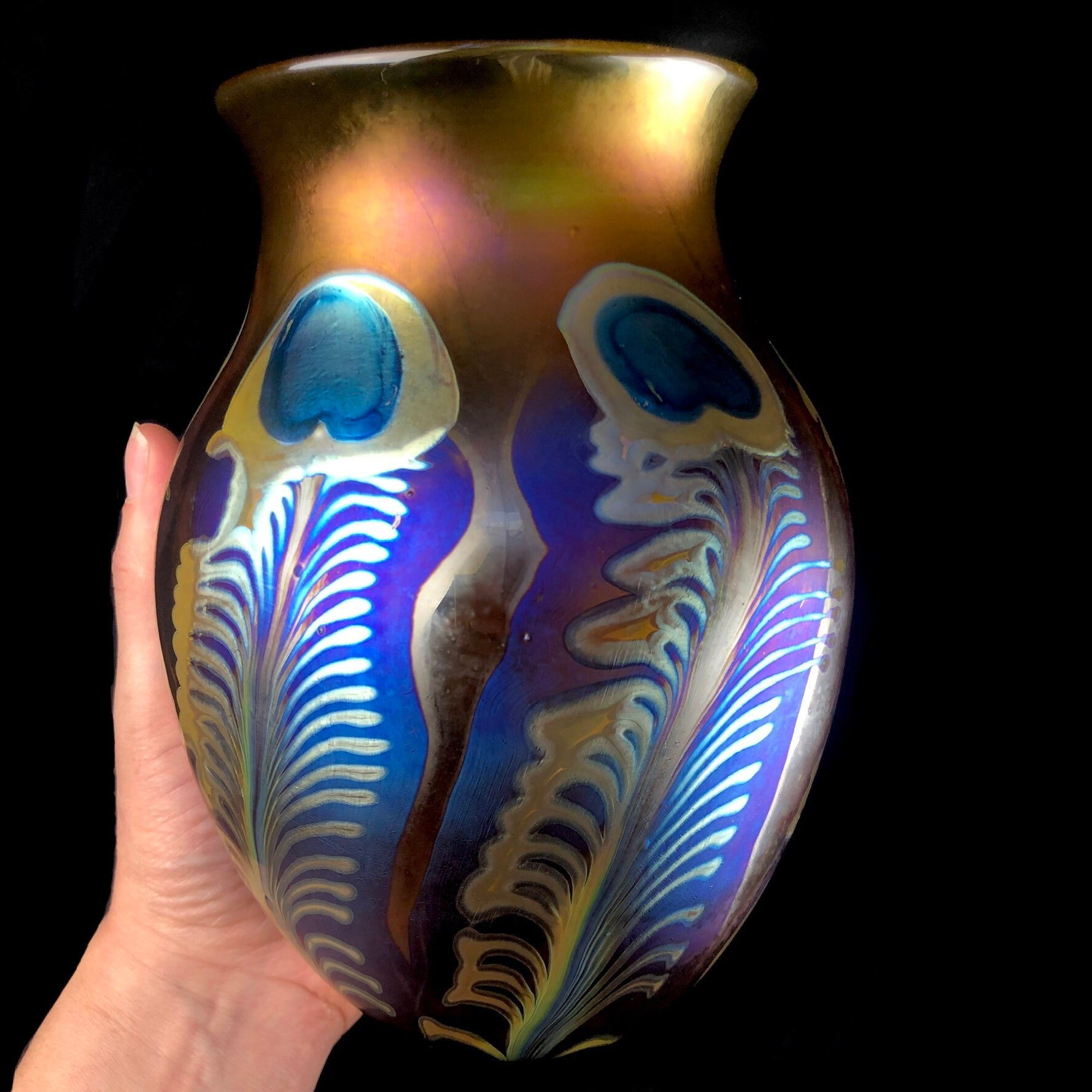 Large Amber Peacock Vase shown in hand