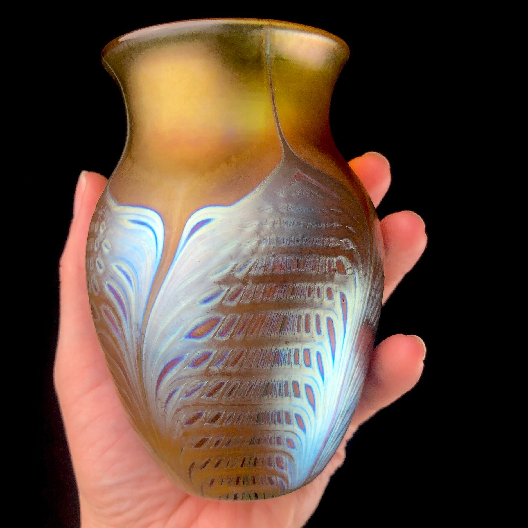 Front view of Amber Cathedral Vase shown in Hand