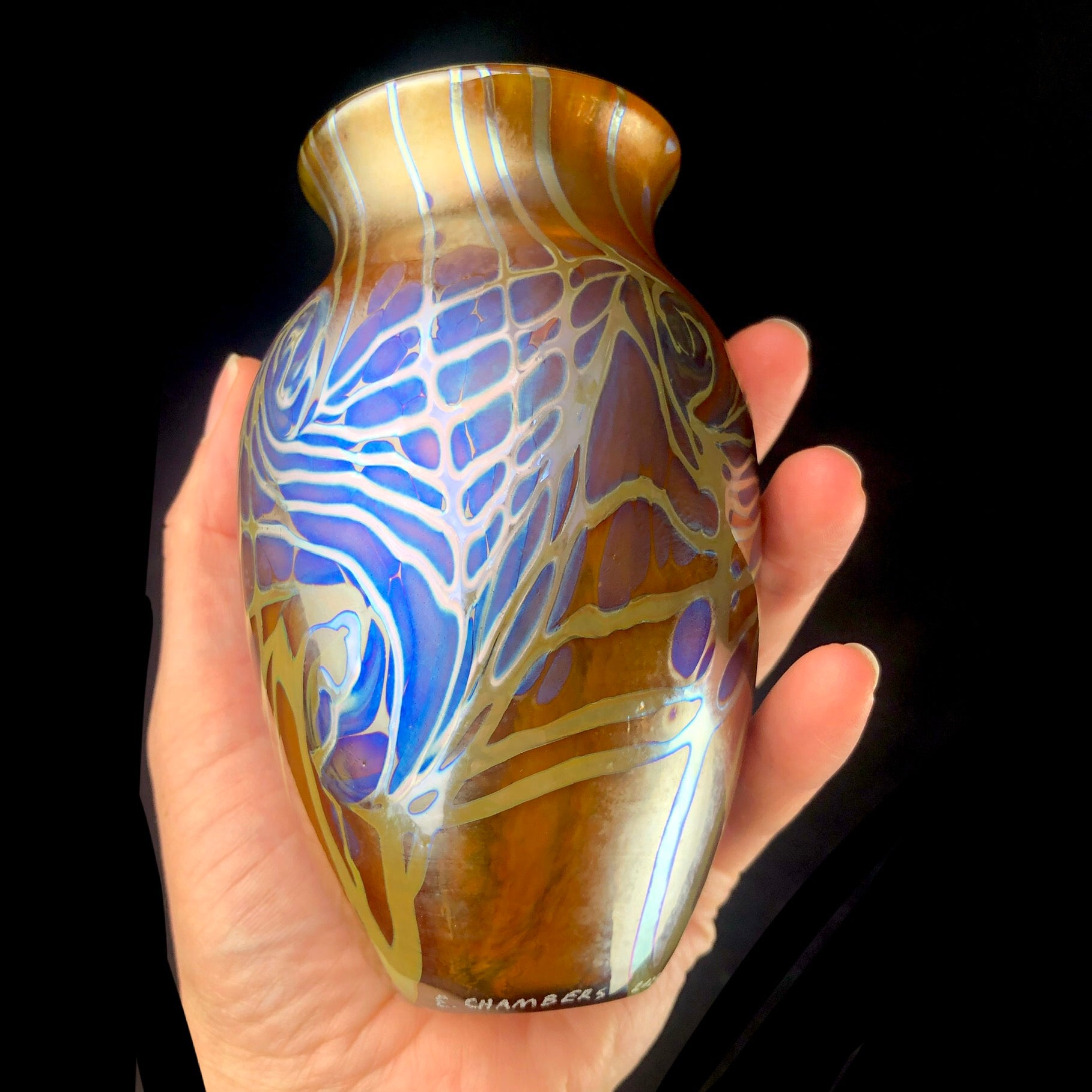 Elongated Amber Starry Night Vase shown in hand