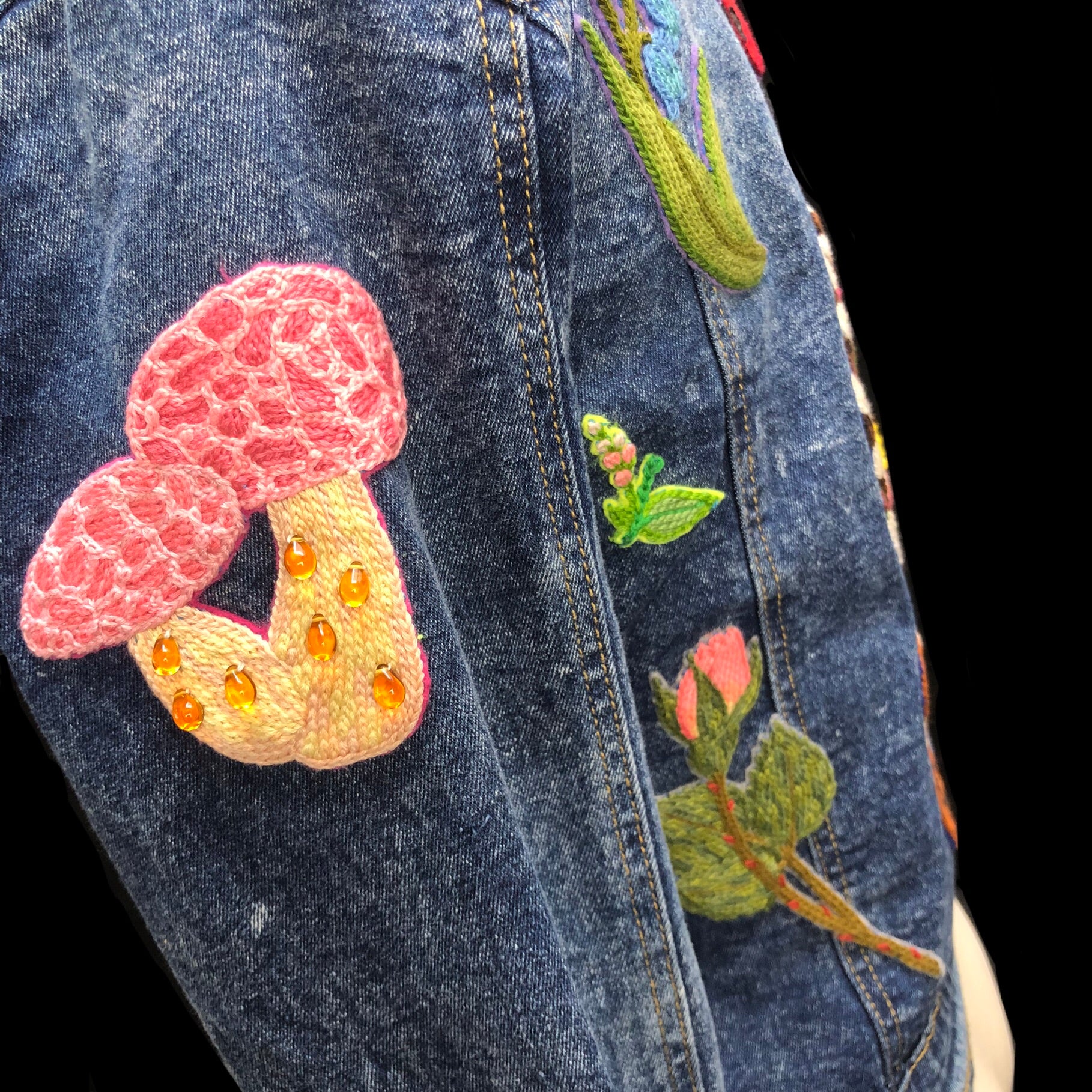 Detail view of mushroom patch on left arm of Beetle jean Jacket
