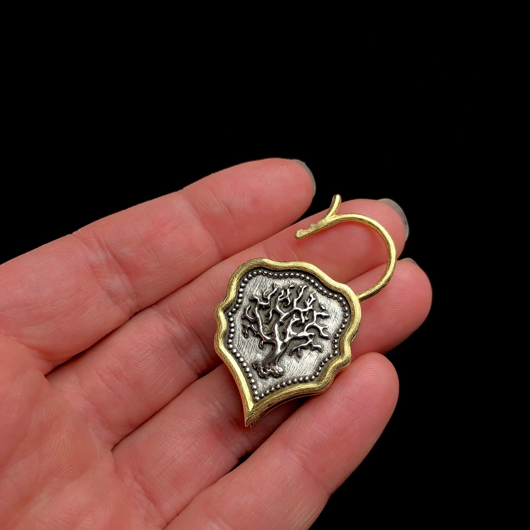Front view of Tree of Life Padlock Charm shown in hand