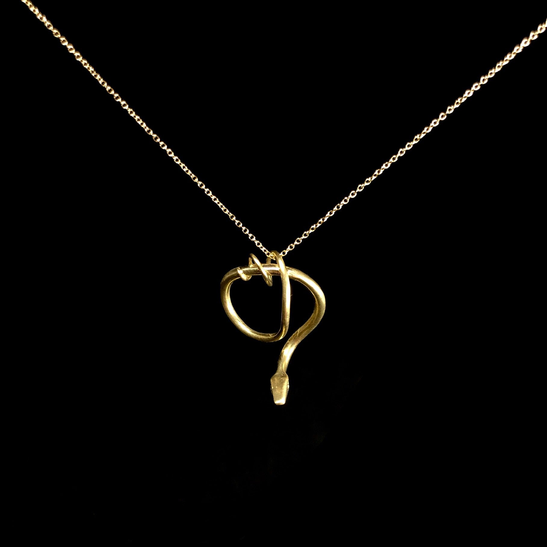 Gold coiled and twisted snake on gold chain