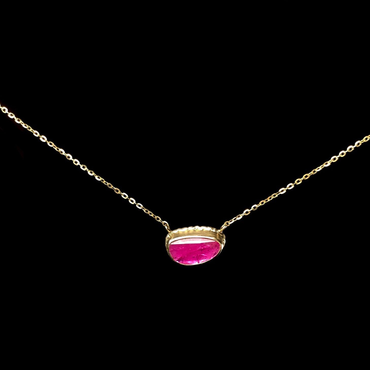 Front view of pink stone necklace with gold chain
