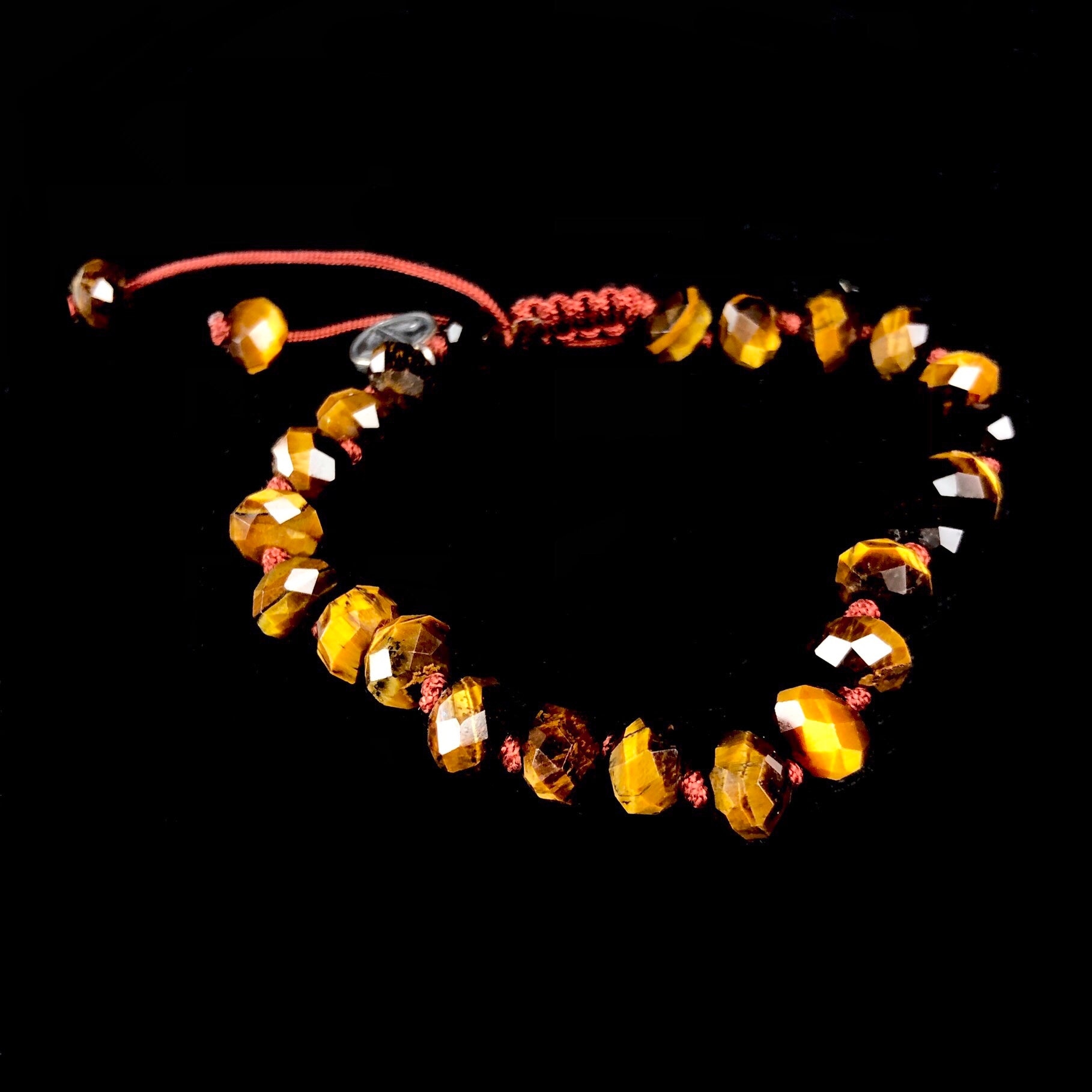 Golden brown iridescent beaded bracelet on brown knotted cord