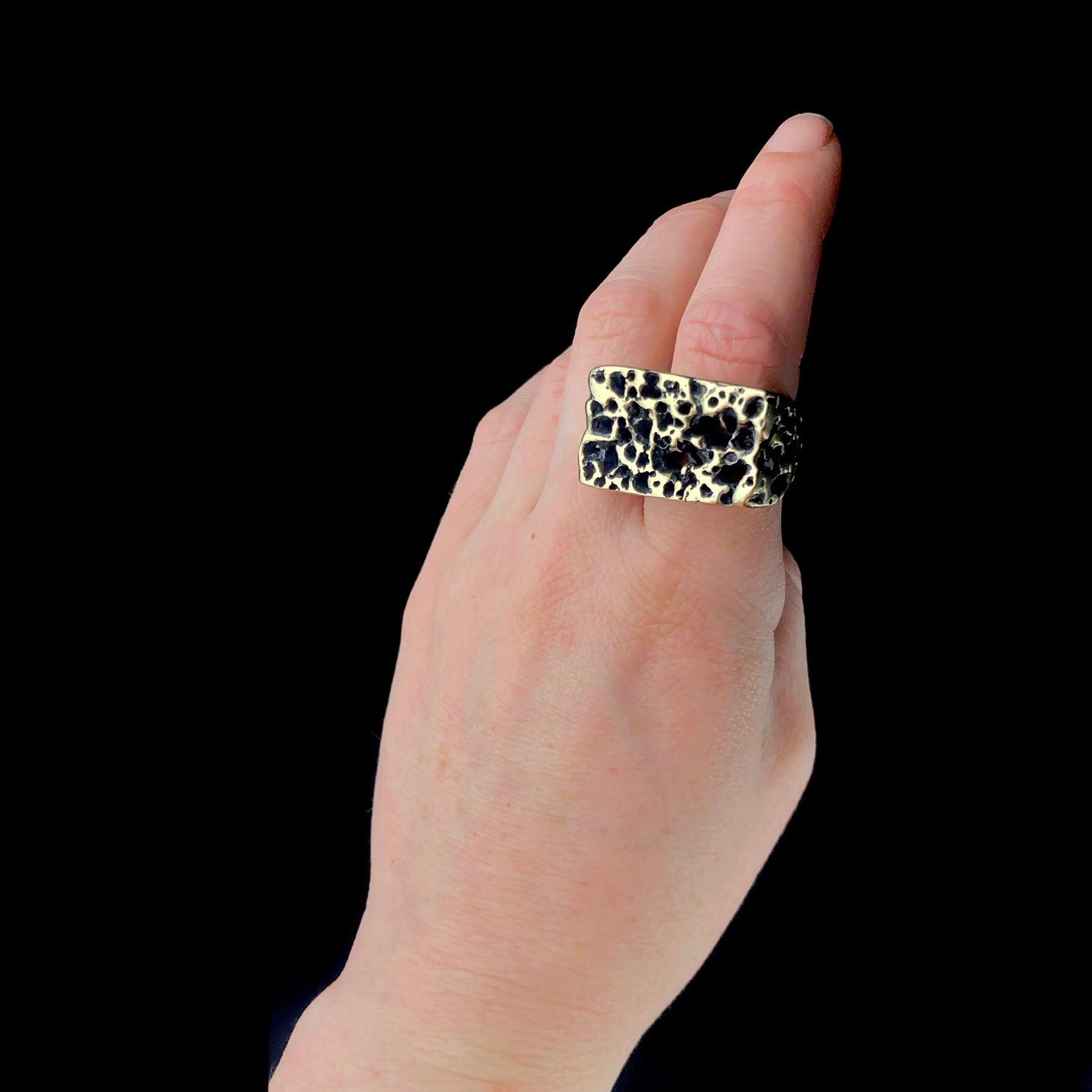 Front view of Atoll Ring shown on hand 