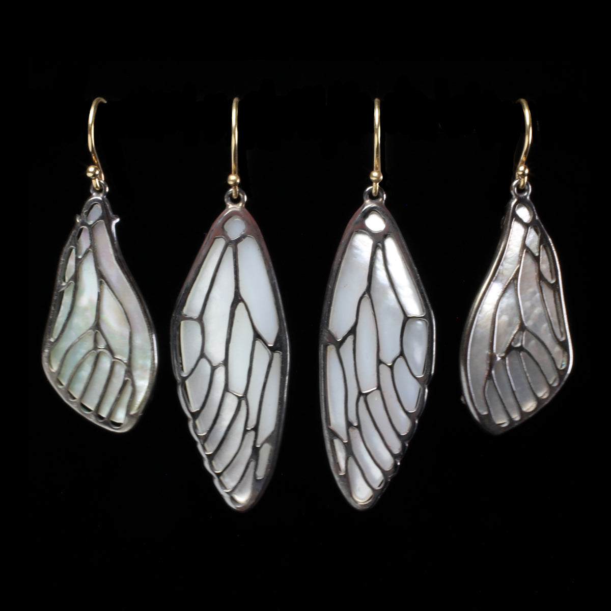 Mother of pearl cicada wing earrings desinged by fine jeweler Annette Ferdinandsen