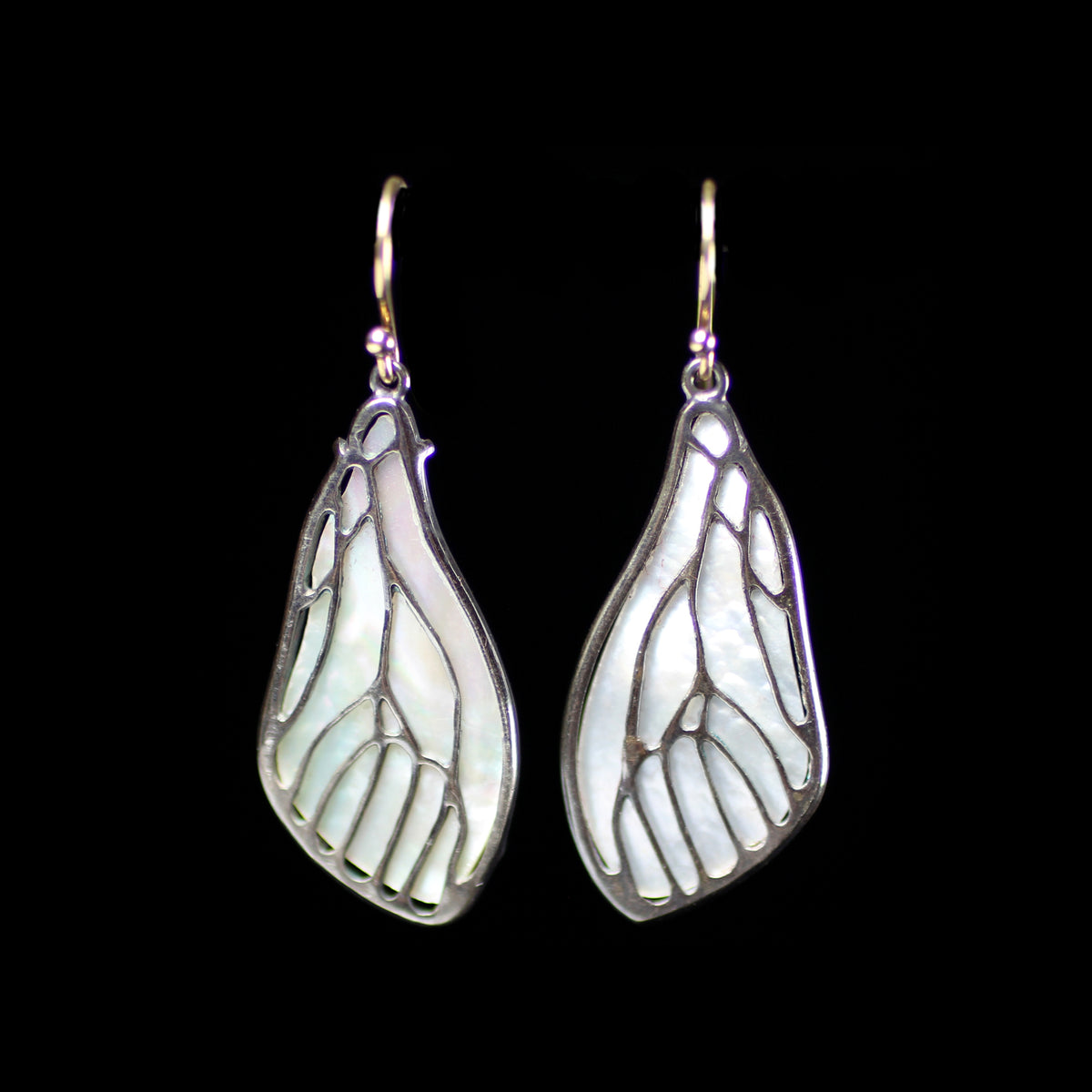 Mother of pearl cicada wing earrings desinged by fine jeweler Annette Ferdinandsen