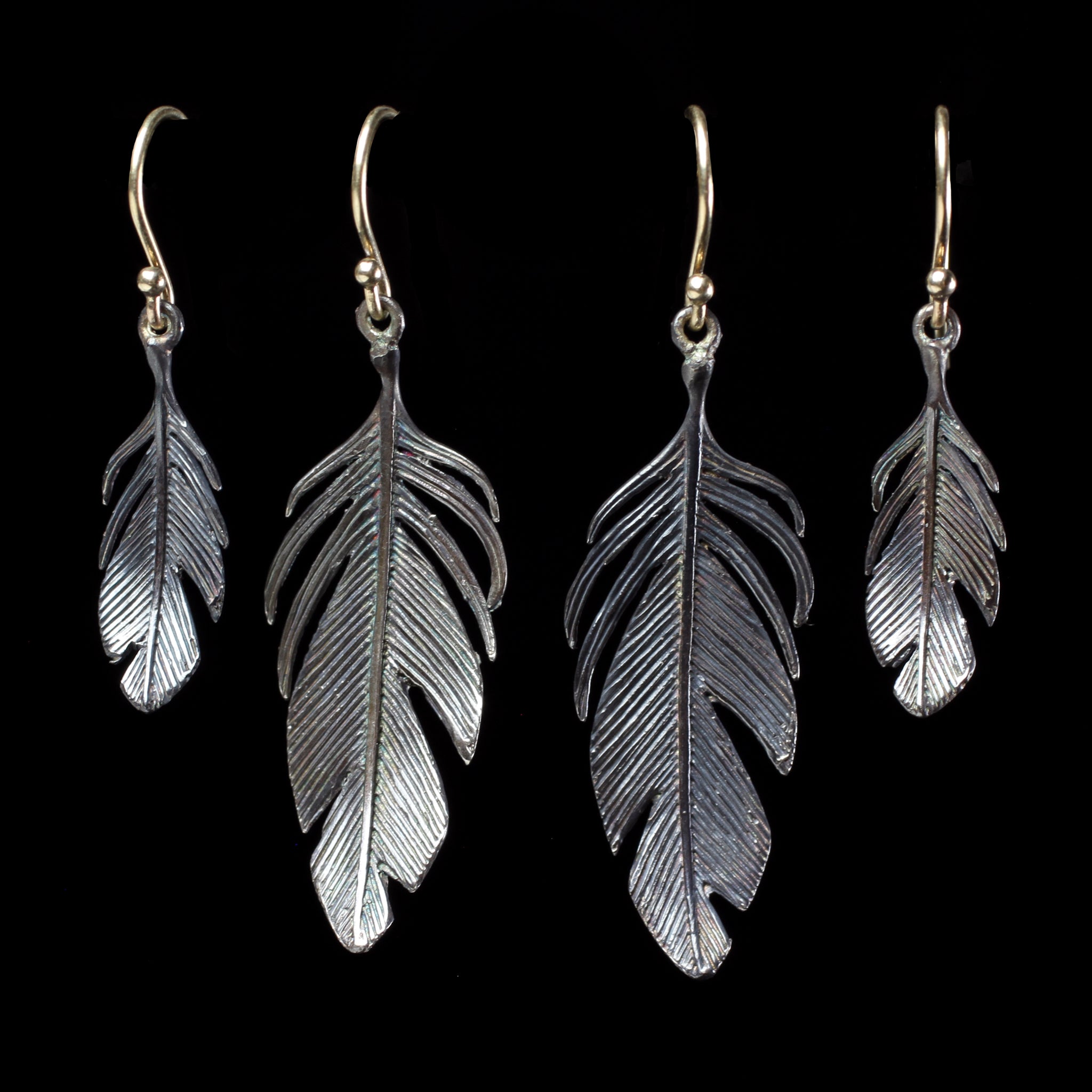 Sterling silver feather earrings hand made by fine jewelry designer Annette Ferdinandsen