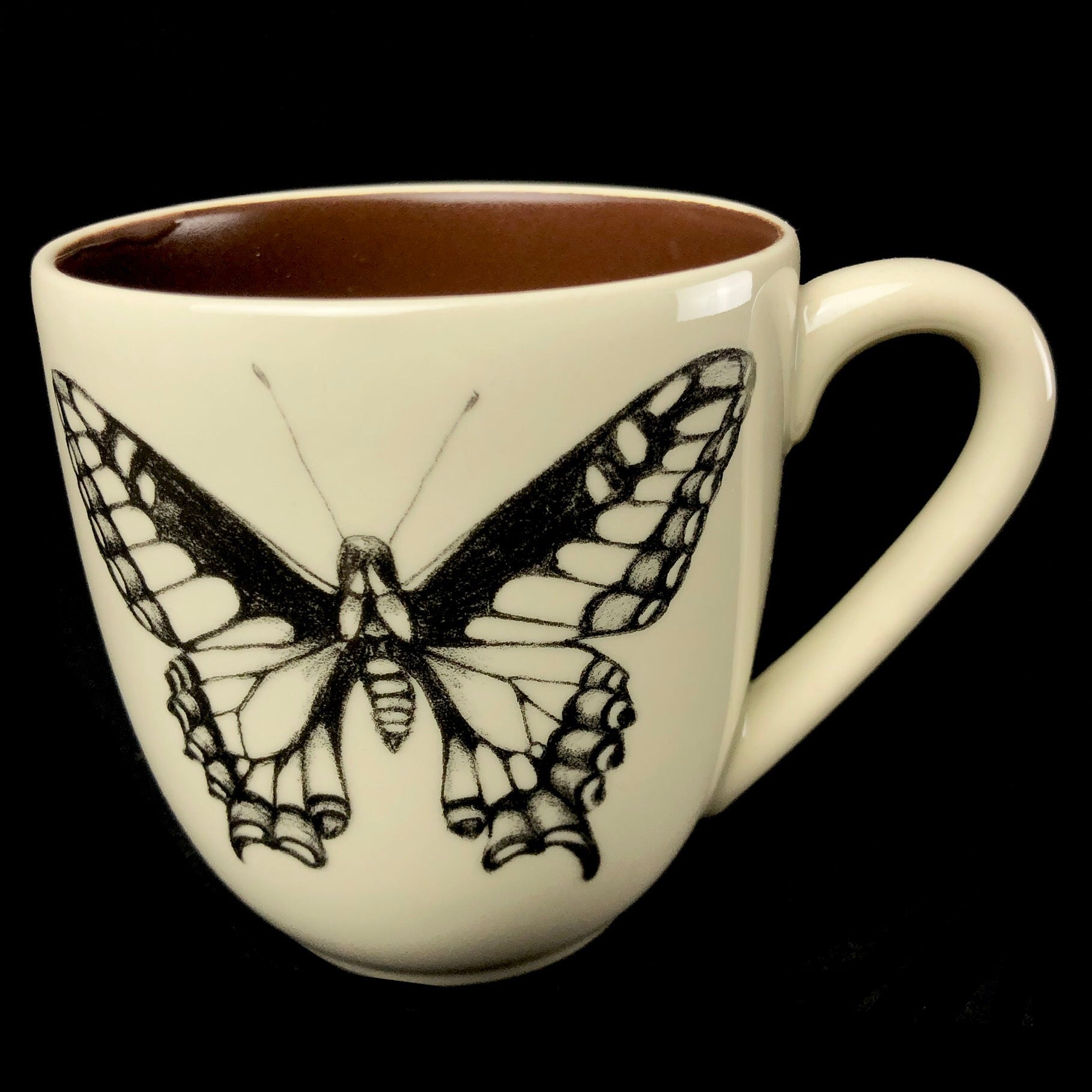 Front view of Butterfly Mug with brown interior