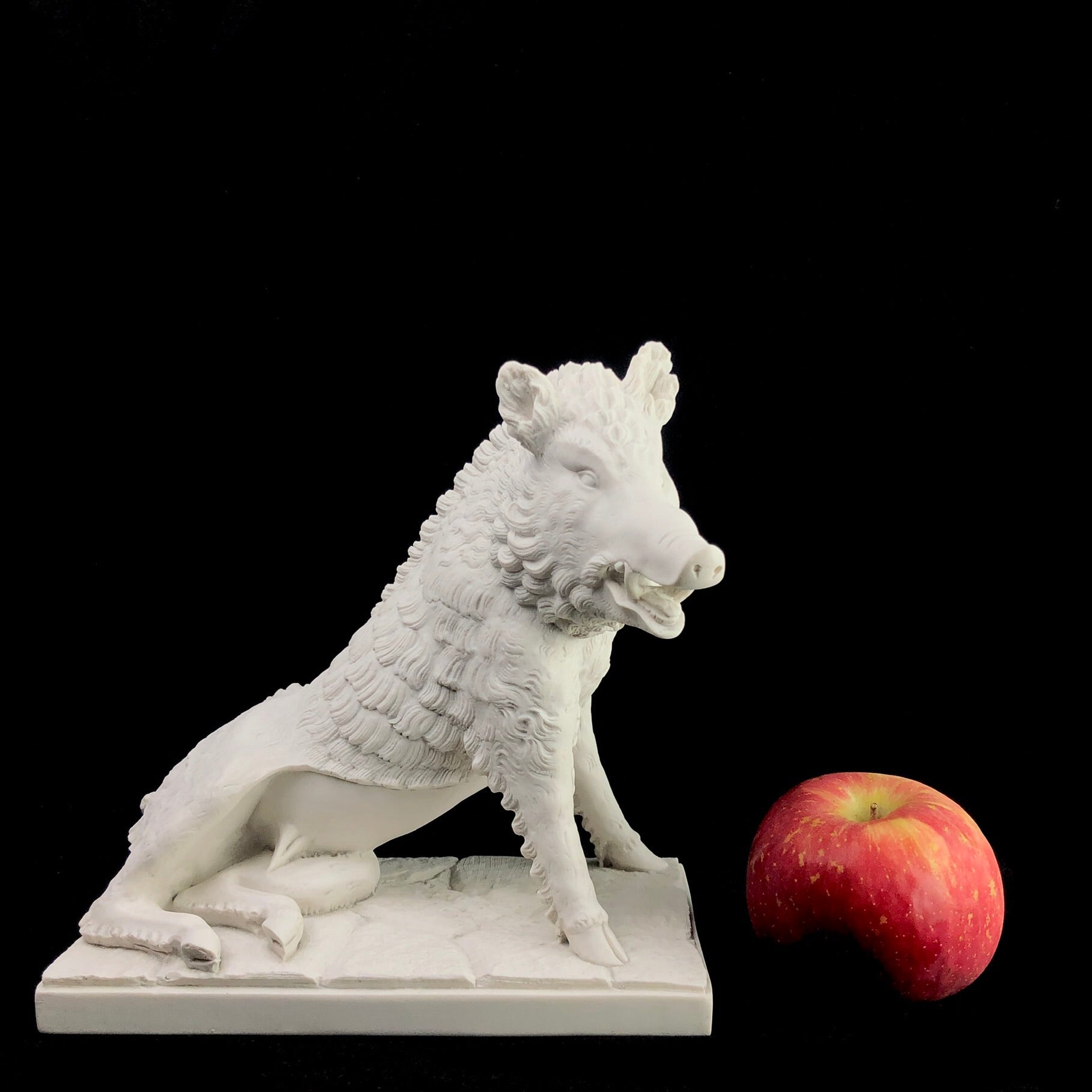 Marble Boar Sculpture next to apple for size reference