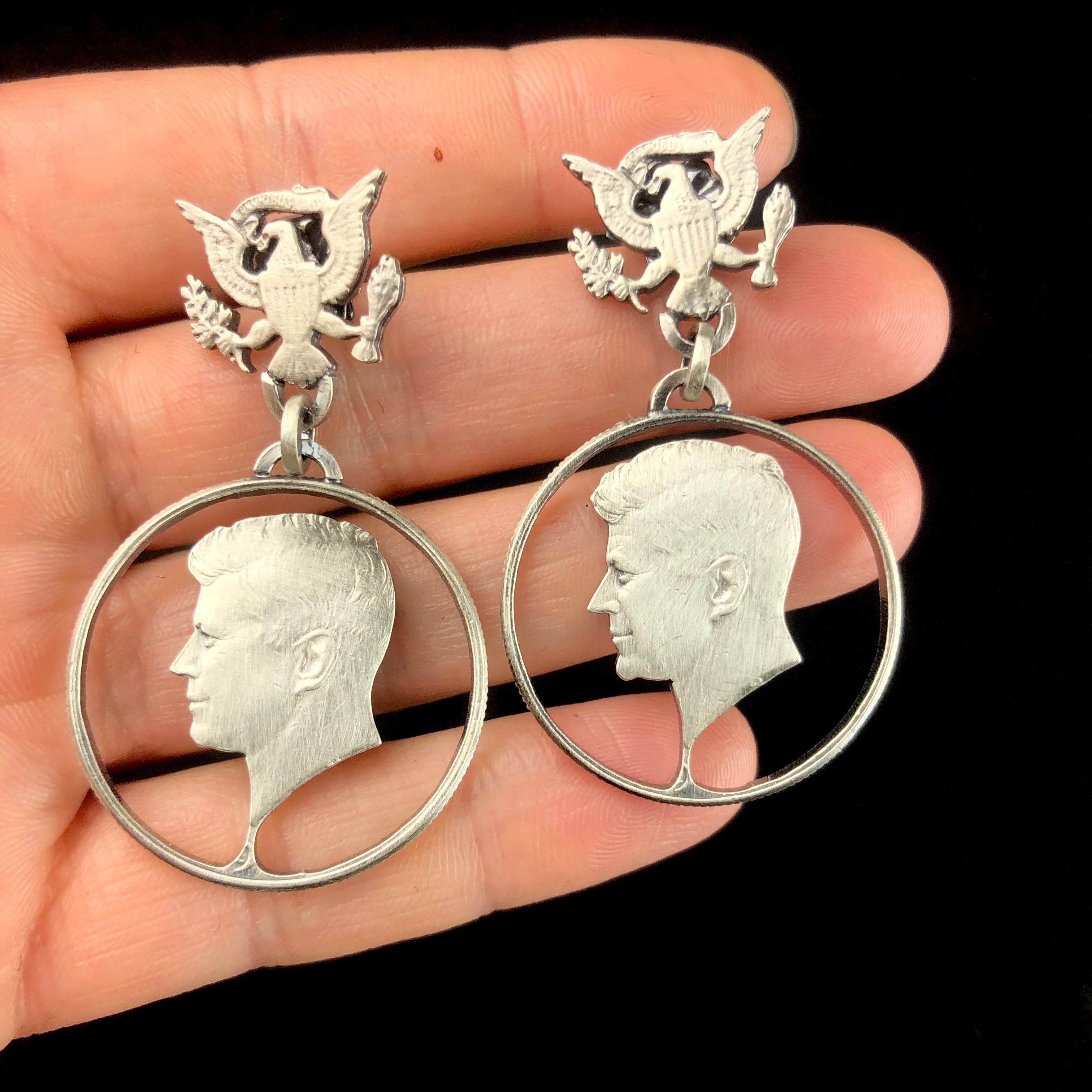 JFK Earrings shown in hand for size reference