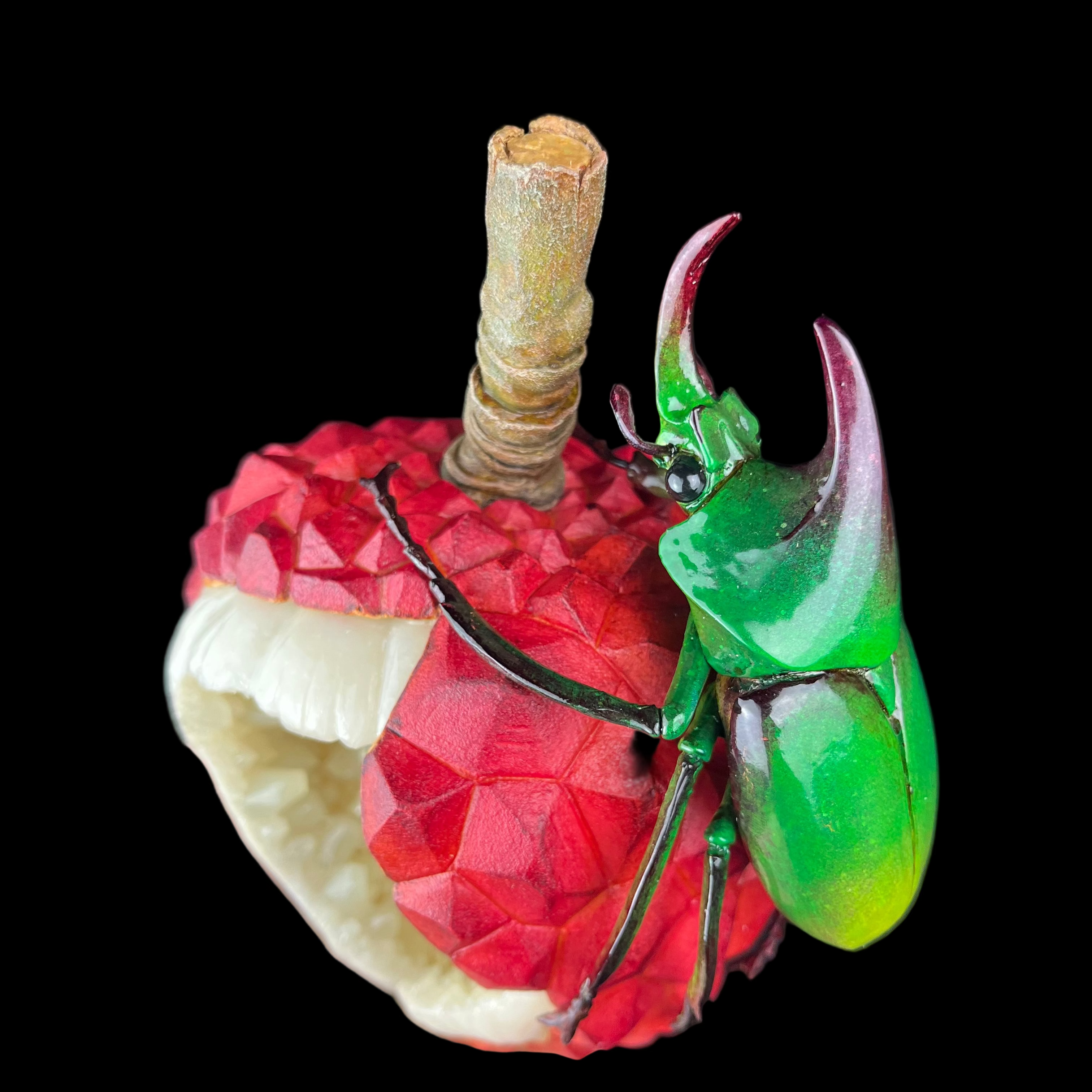 Green beetle on a red fruit against a dark background