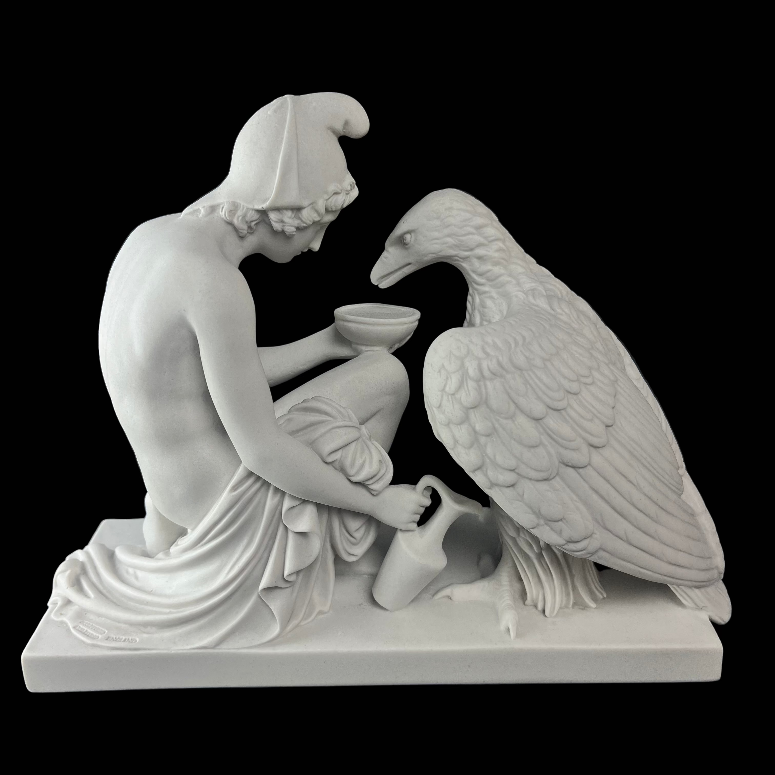 Statue of a classical figure with an eagle on a dark background