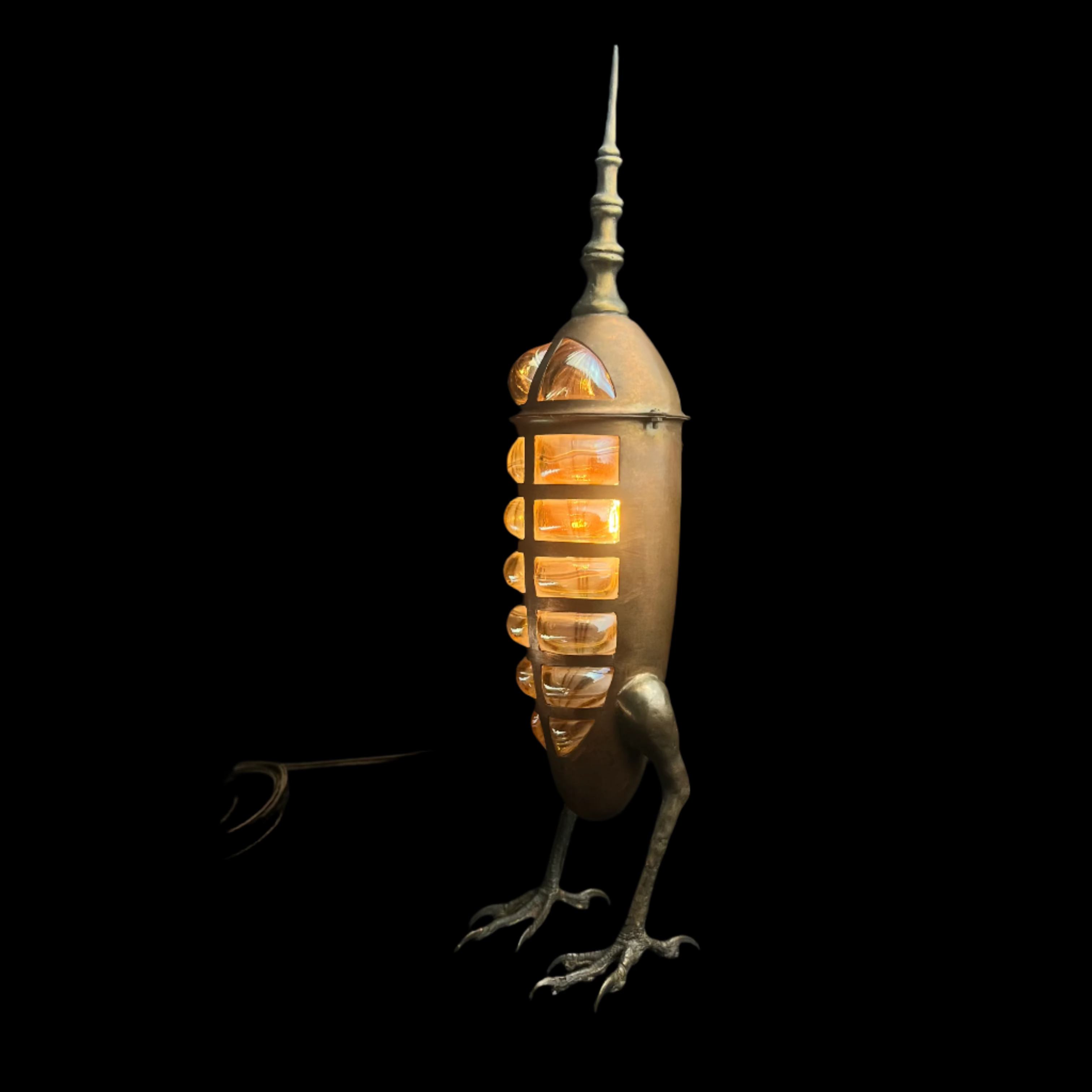 Decorative lamp shaped like a bird with a glowing interior on a dark background