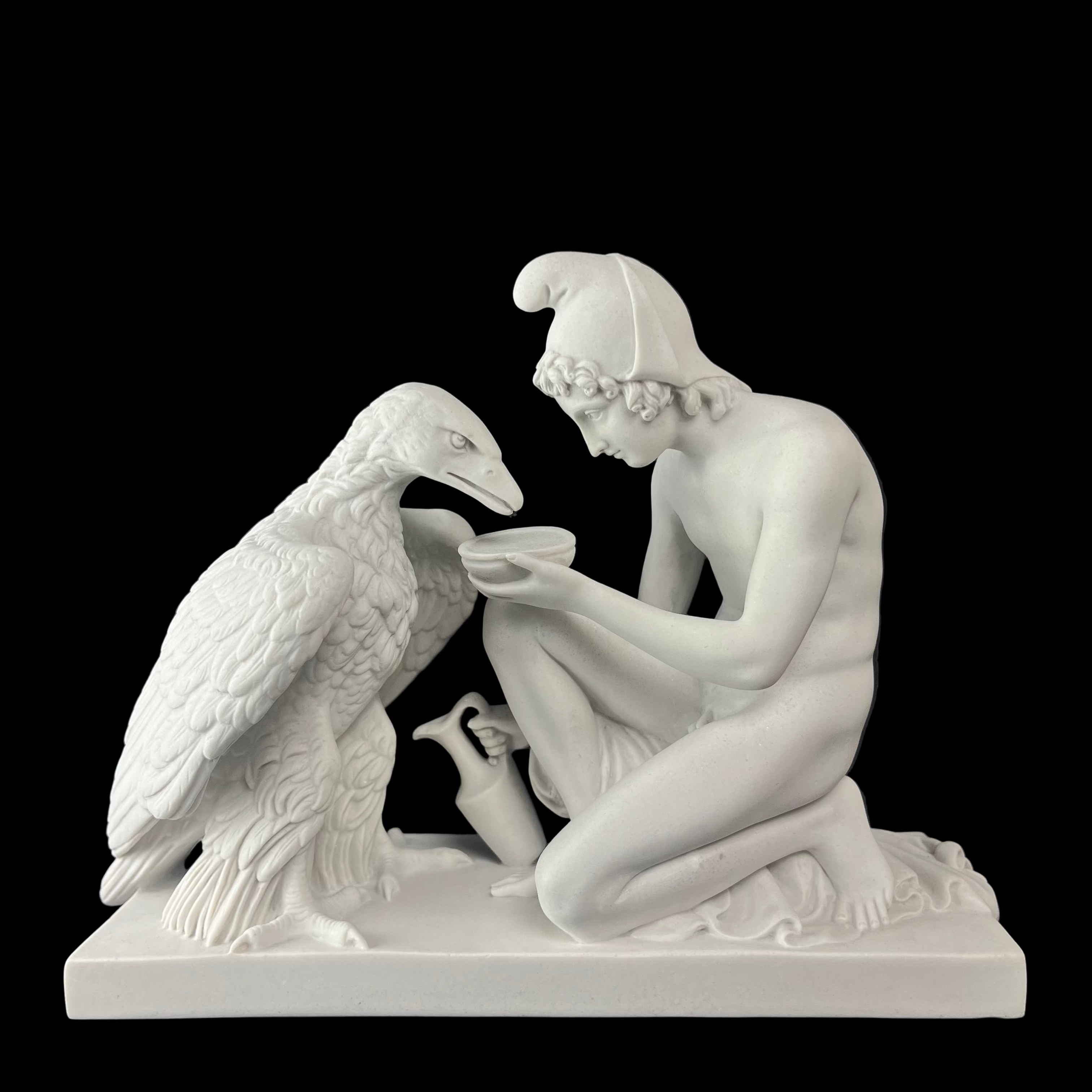 White marble statue of a woman interacting with a bird on a dark background