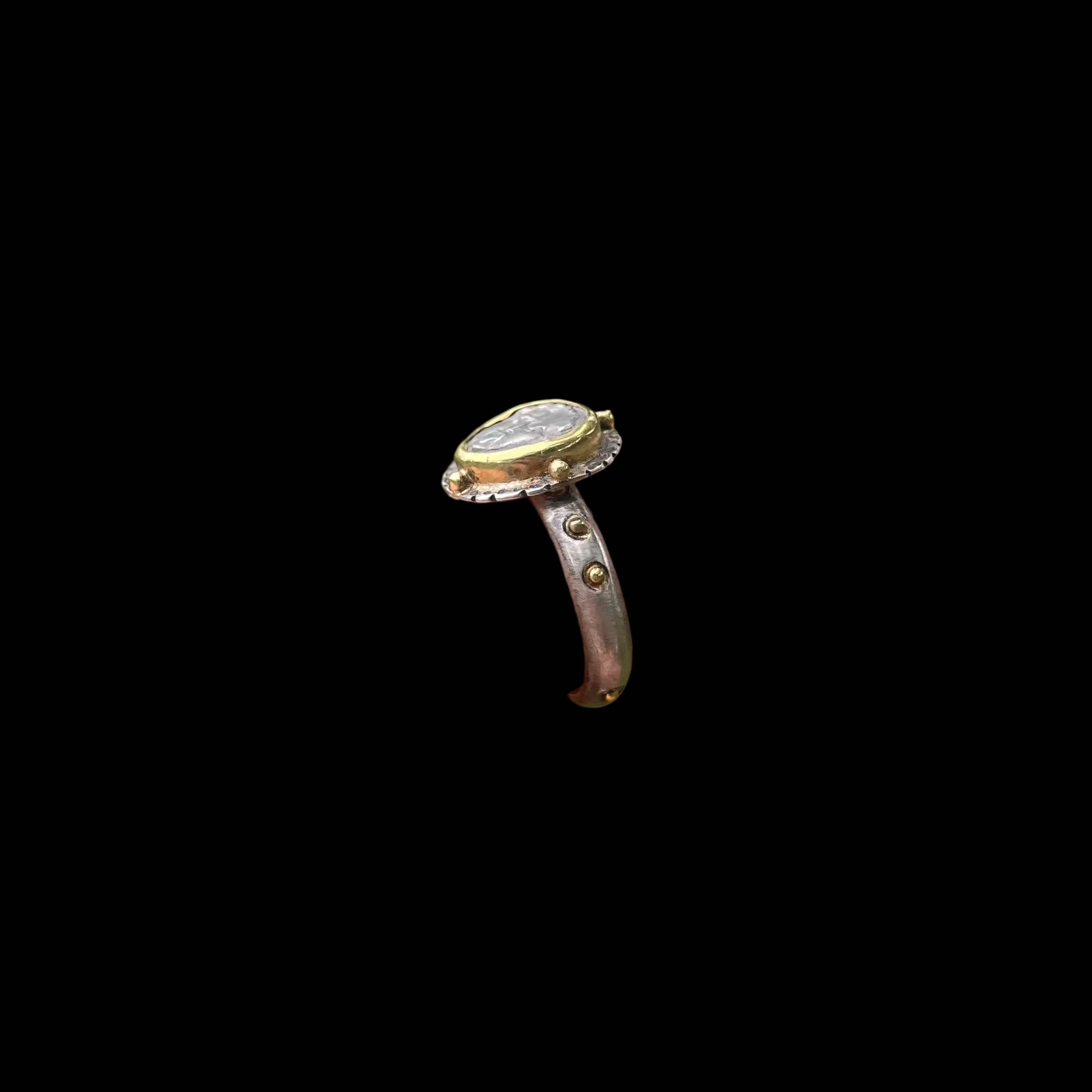Side view of a ring on black background