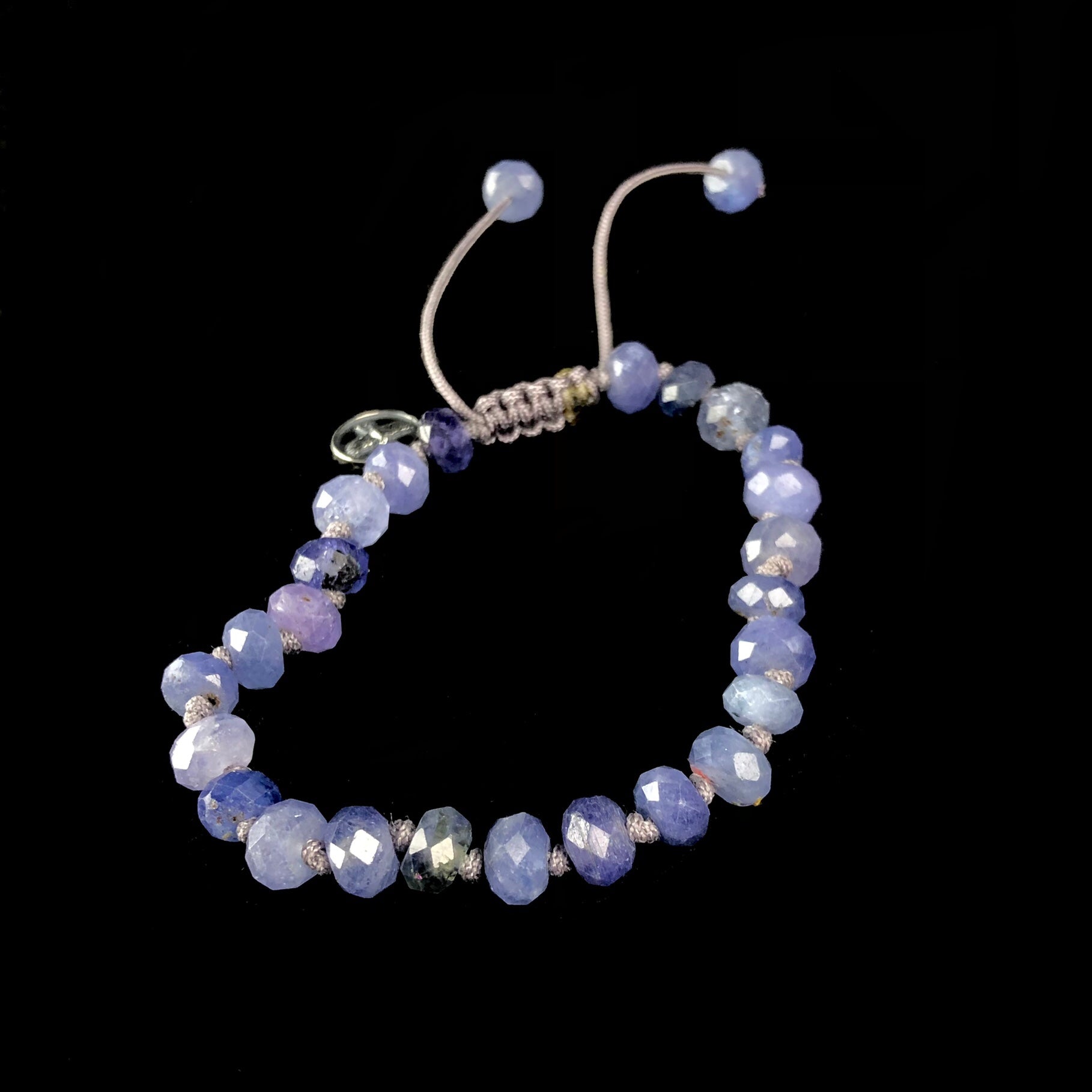 Lavender colored stone bead bracelet on knotted on lavender colored cord 