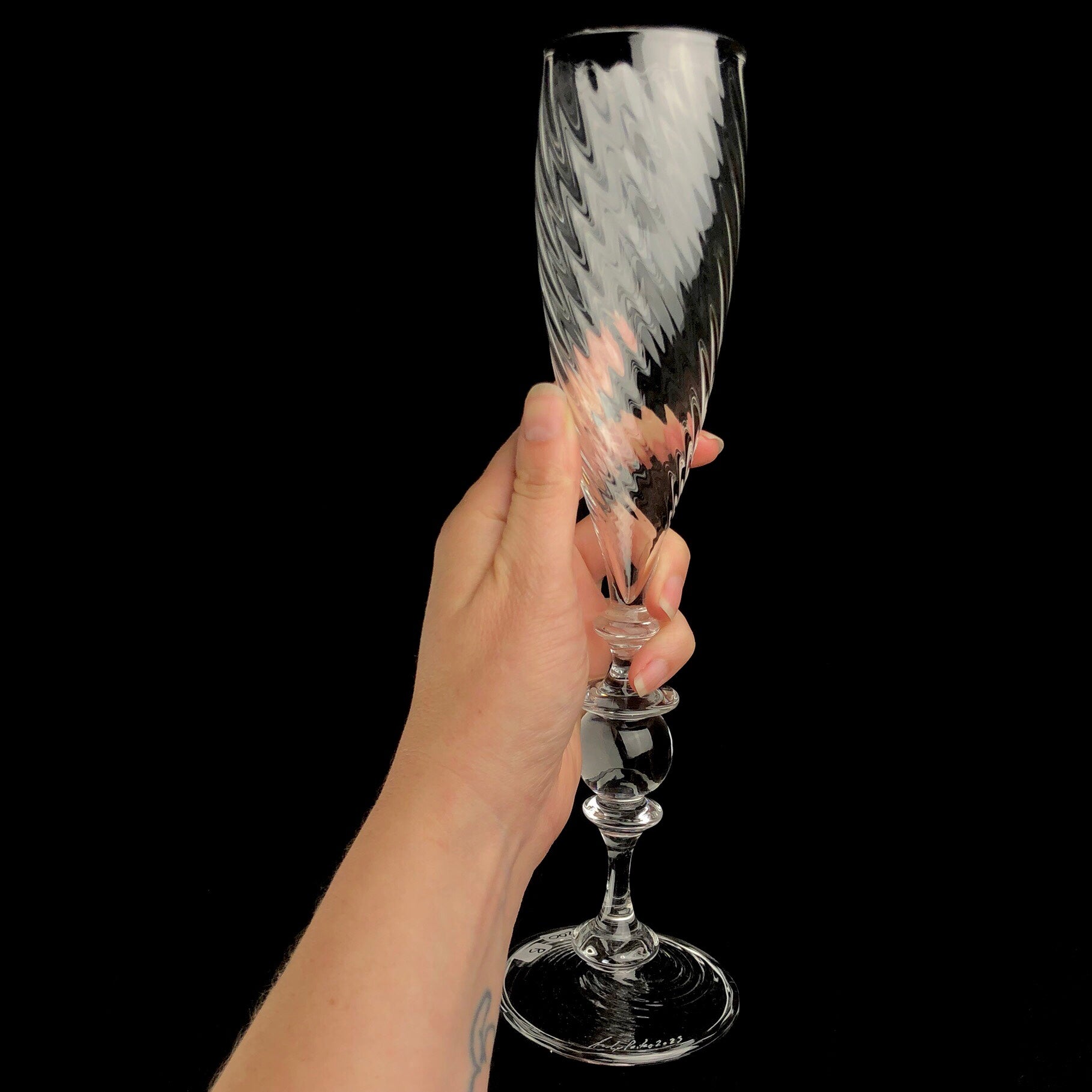 Champagne Flute shown in hand