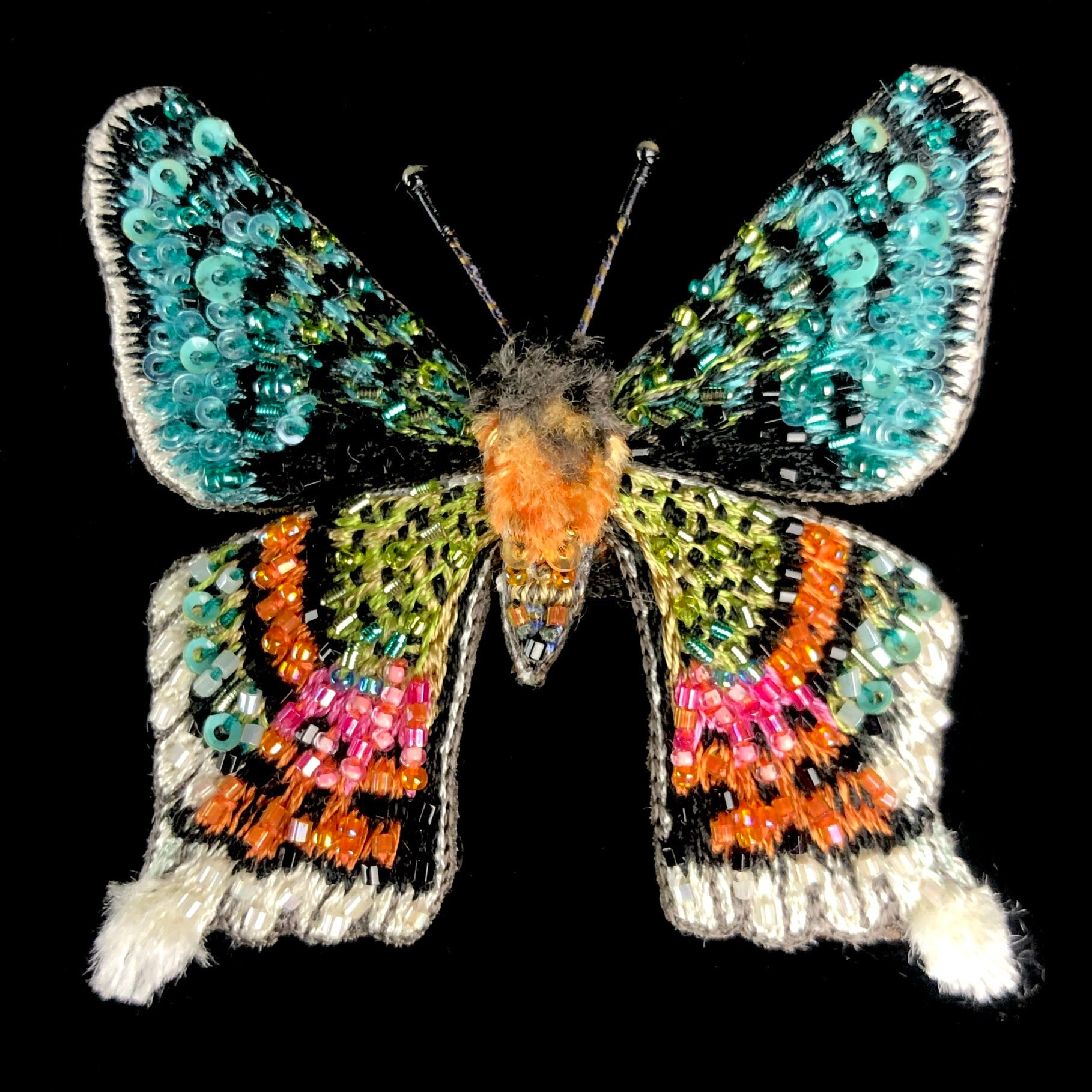Rainbow colored glass beads and reflective sequins embroidered moth
