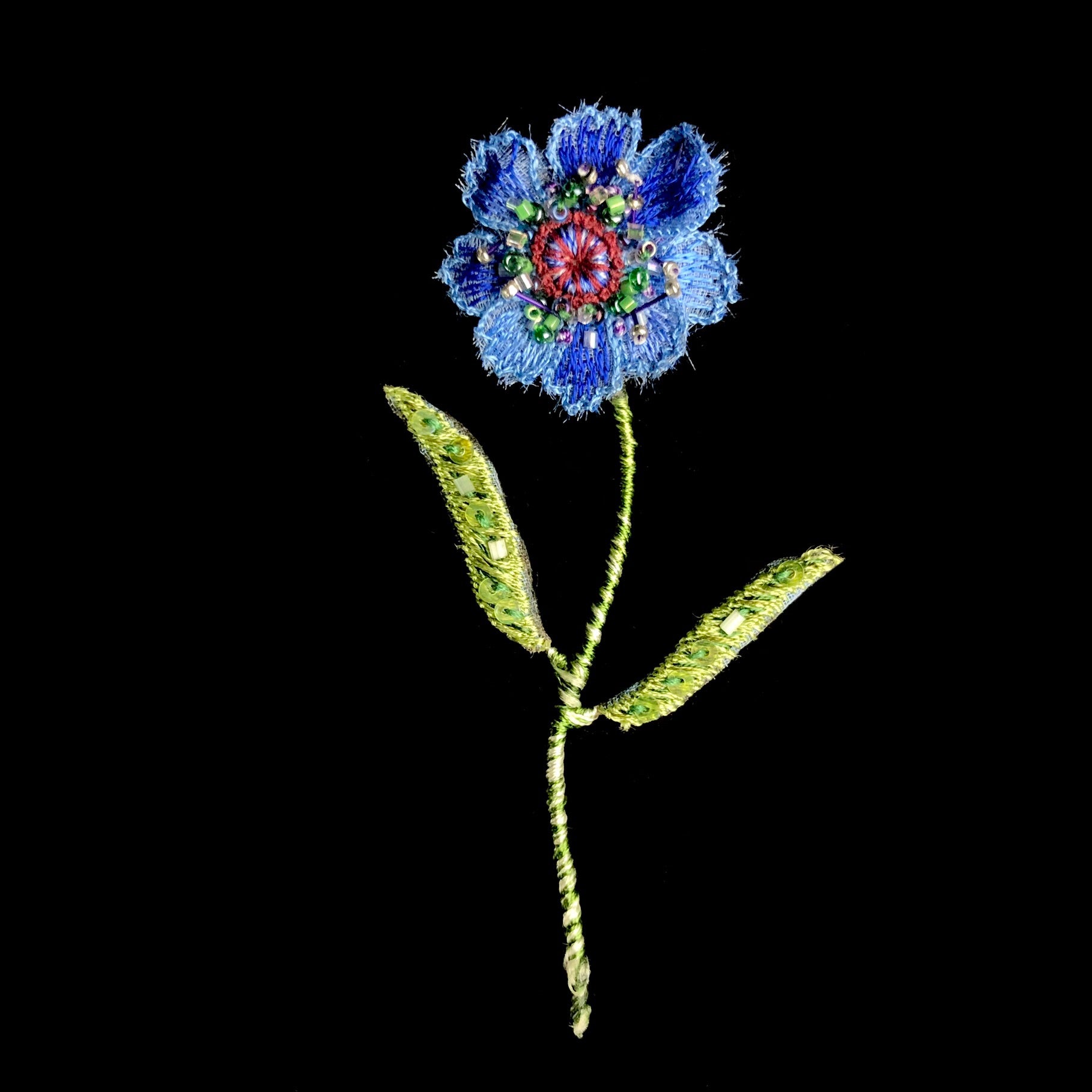 Blue Flower Embroidered flower with green stem and two leaves