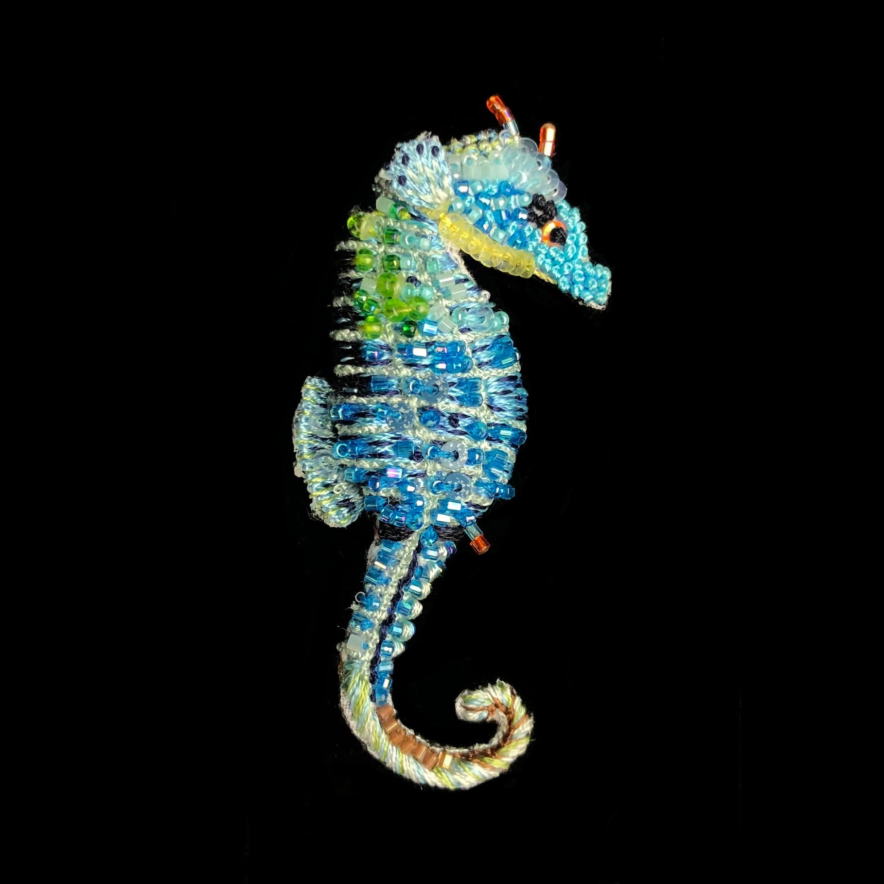 Blue and green embroidered seahorse