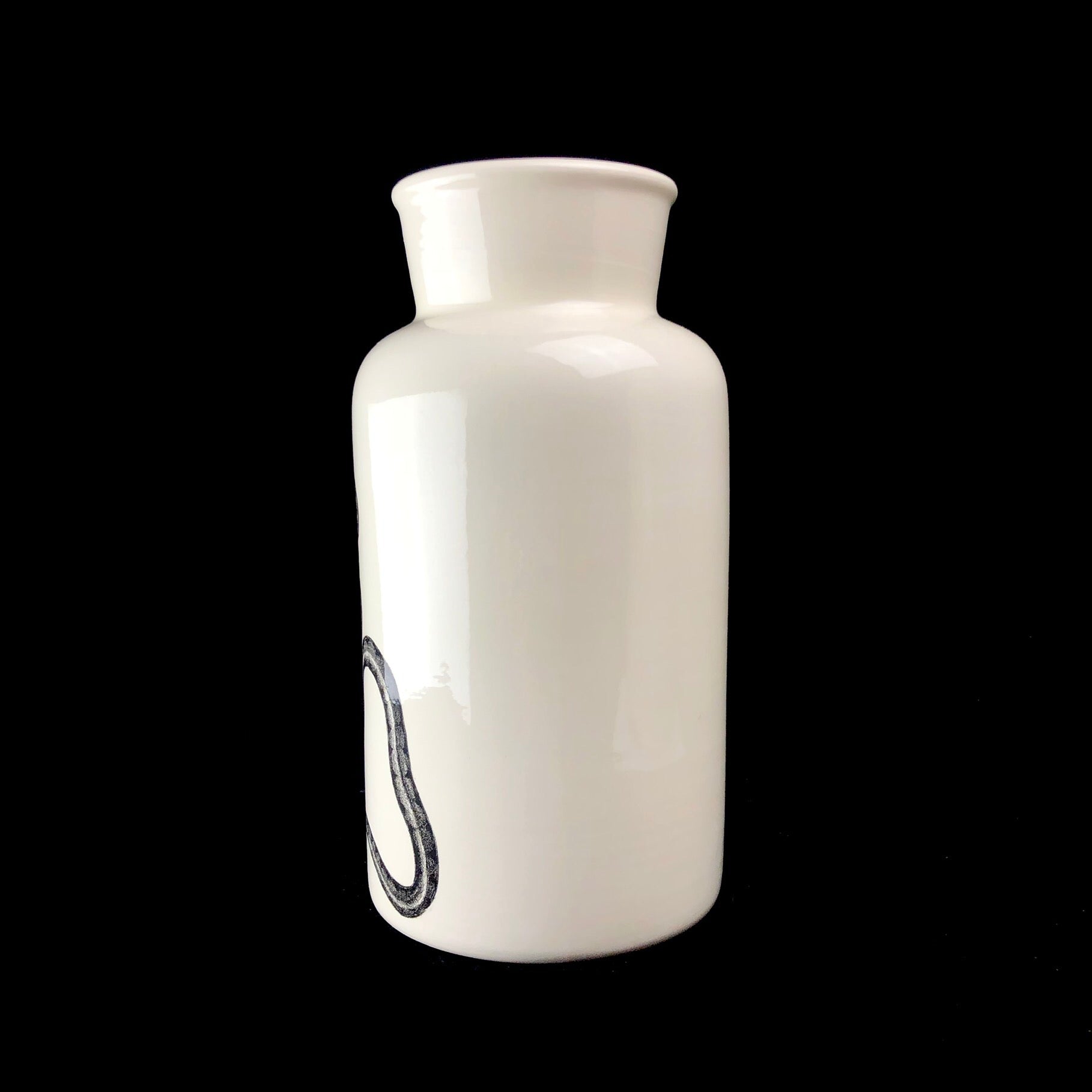 White vase on black background