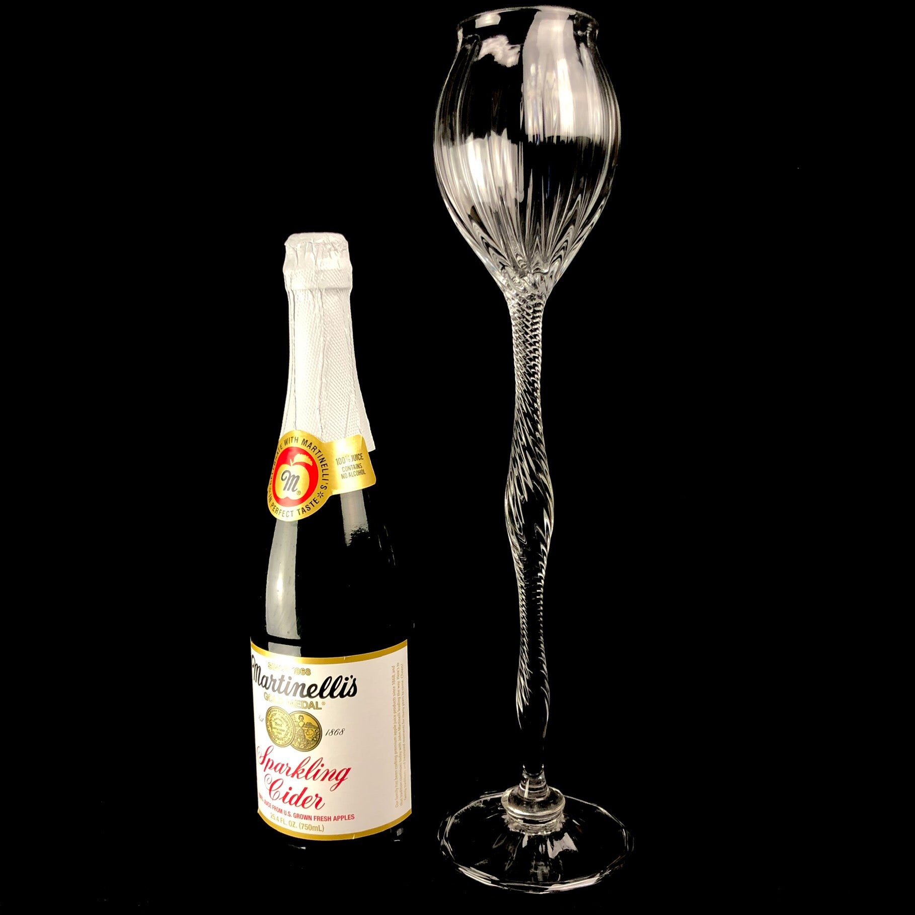 Oversized Glass Goblet shown next to a full size champagne bottle