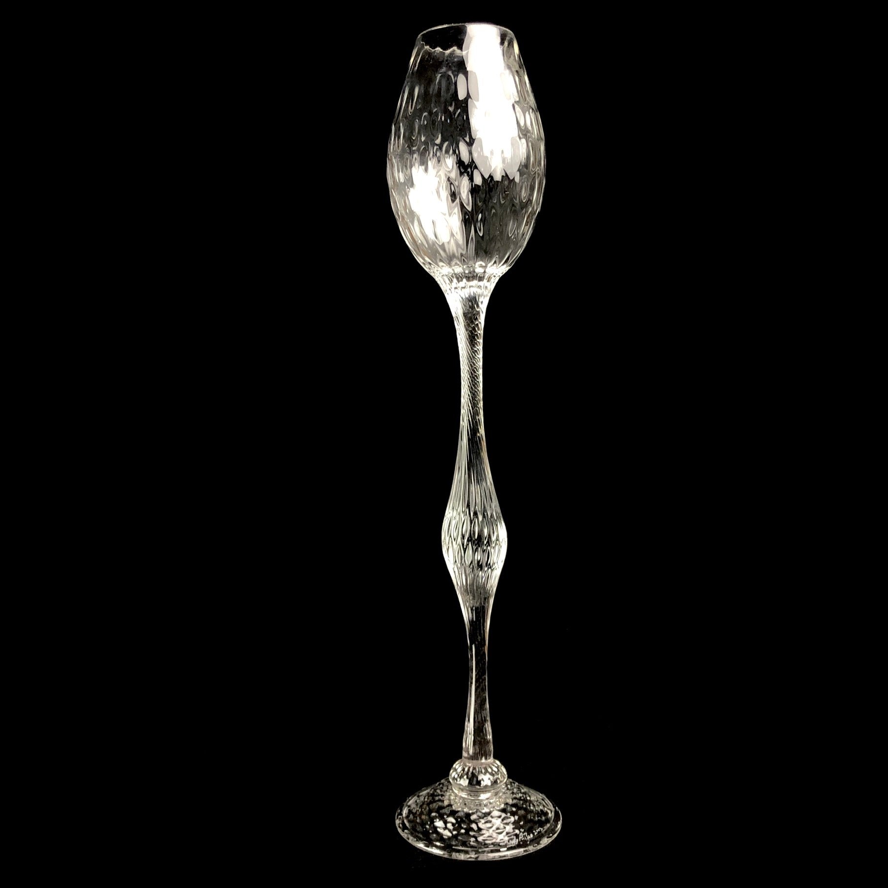 Clear glass goblet with intricate ribbed surface design