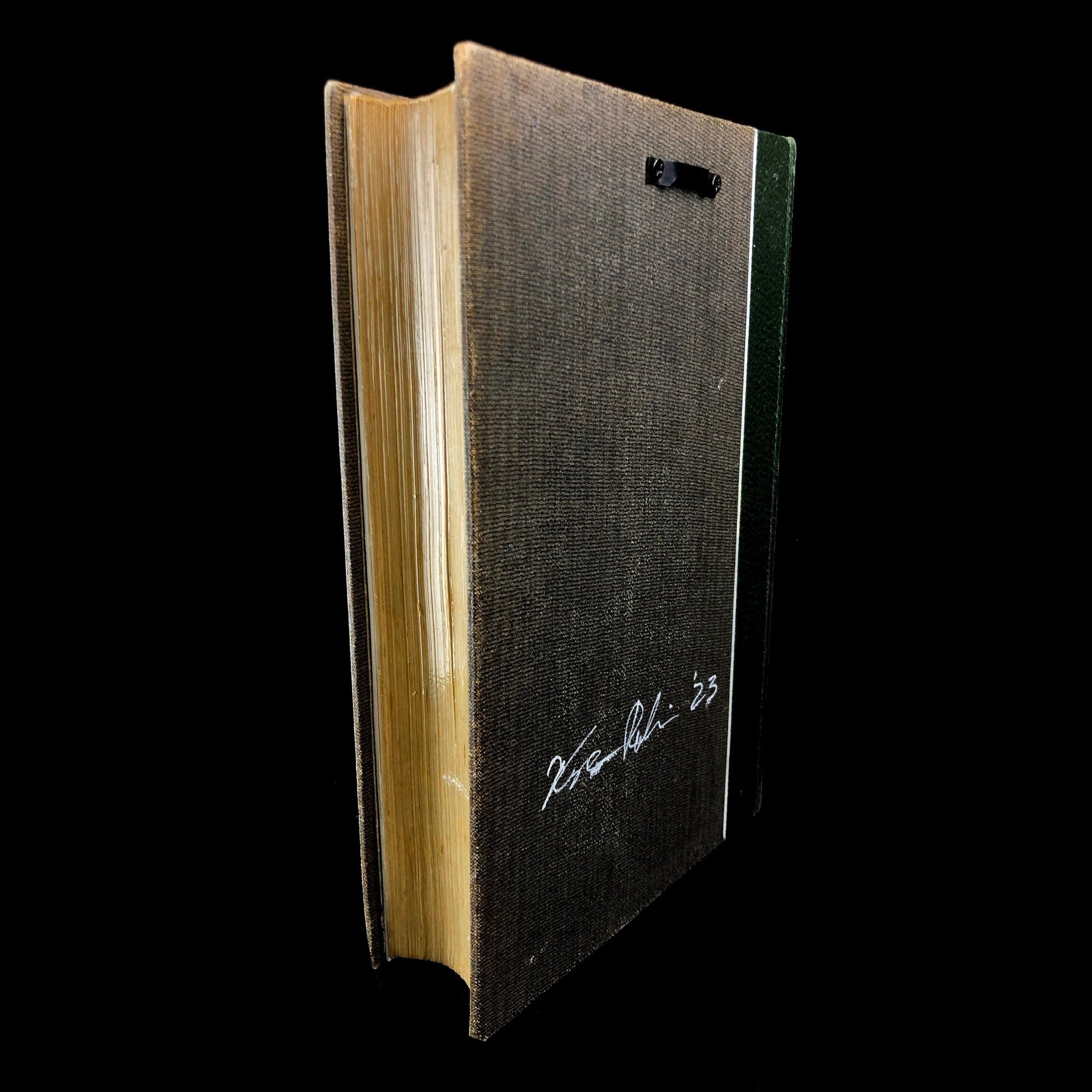 Pages and back of book with hanger and artists signature