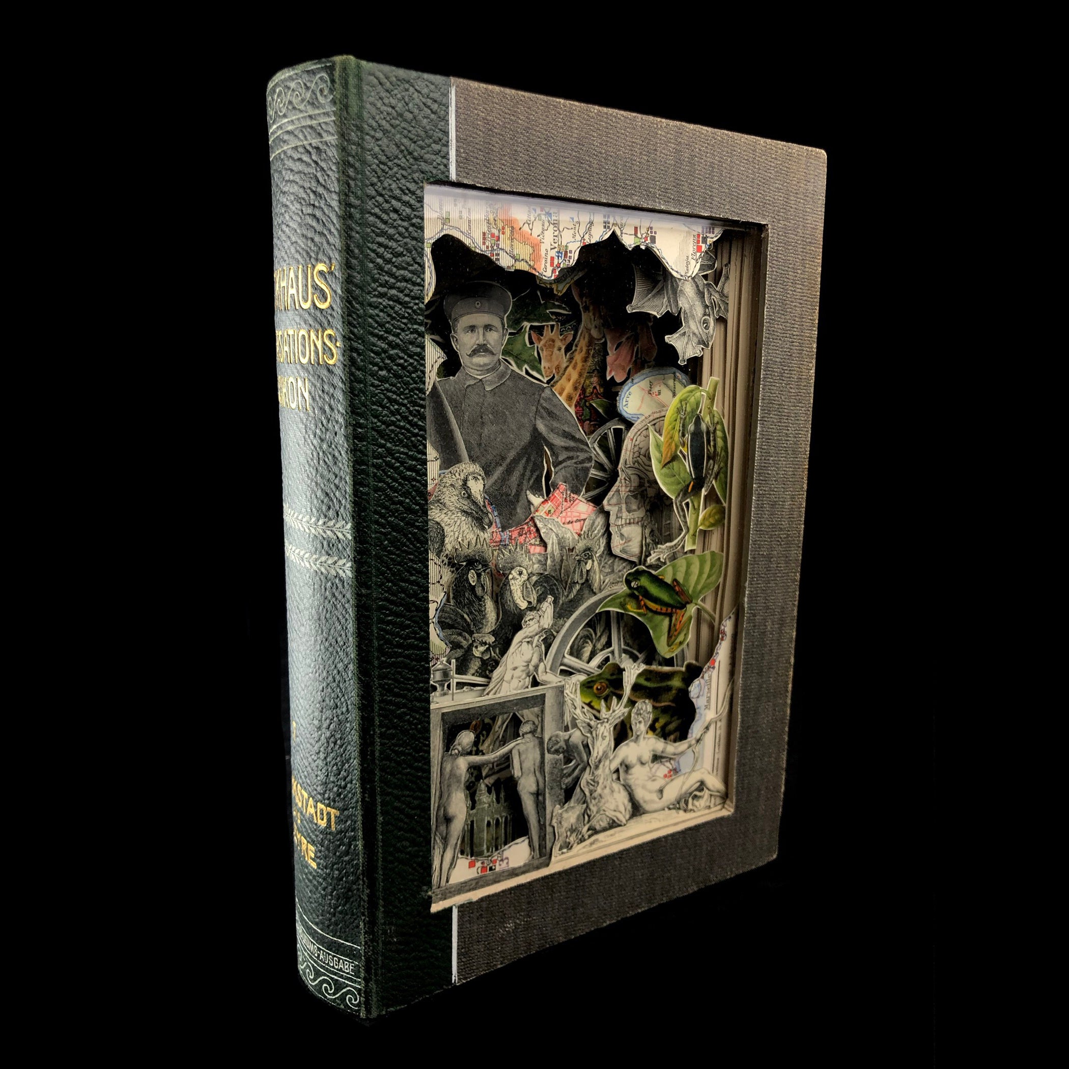 Side view of spine of book and front with clear window to art inside book