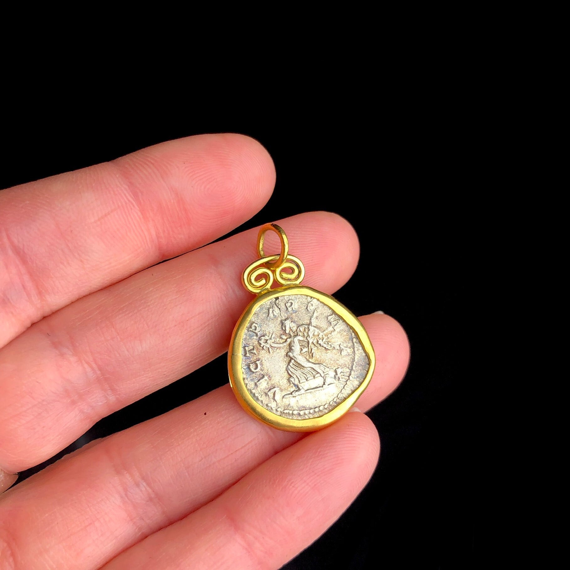 Ancient Coin of Victory Pendent shown in hand